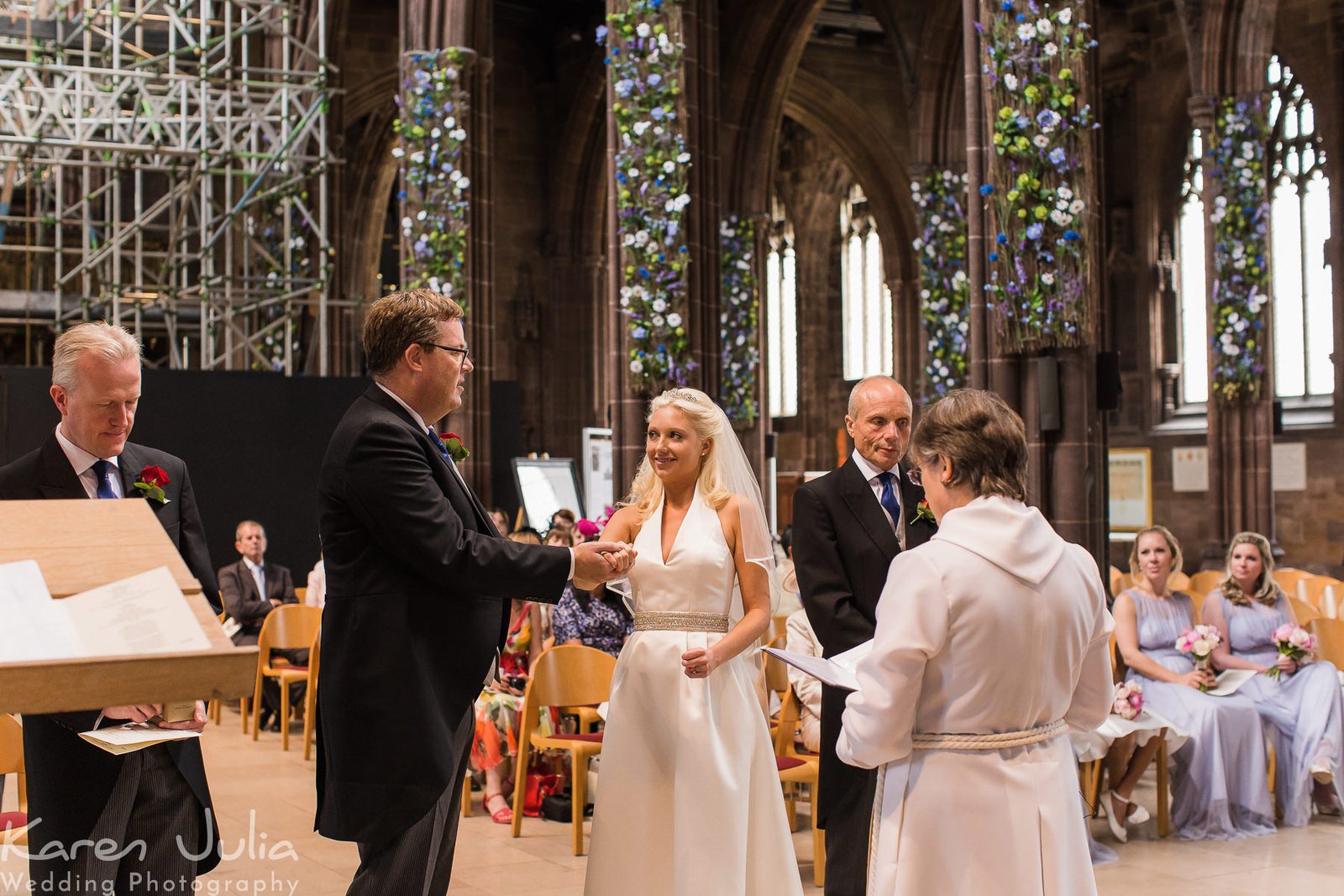 bride and groom during their wedding ceremony at Manchester Cathedral