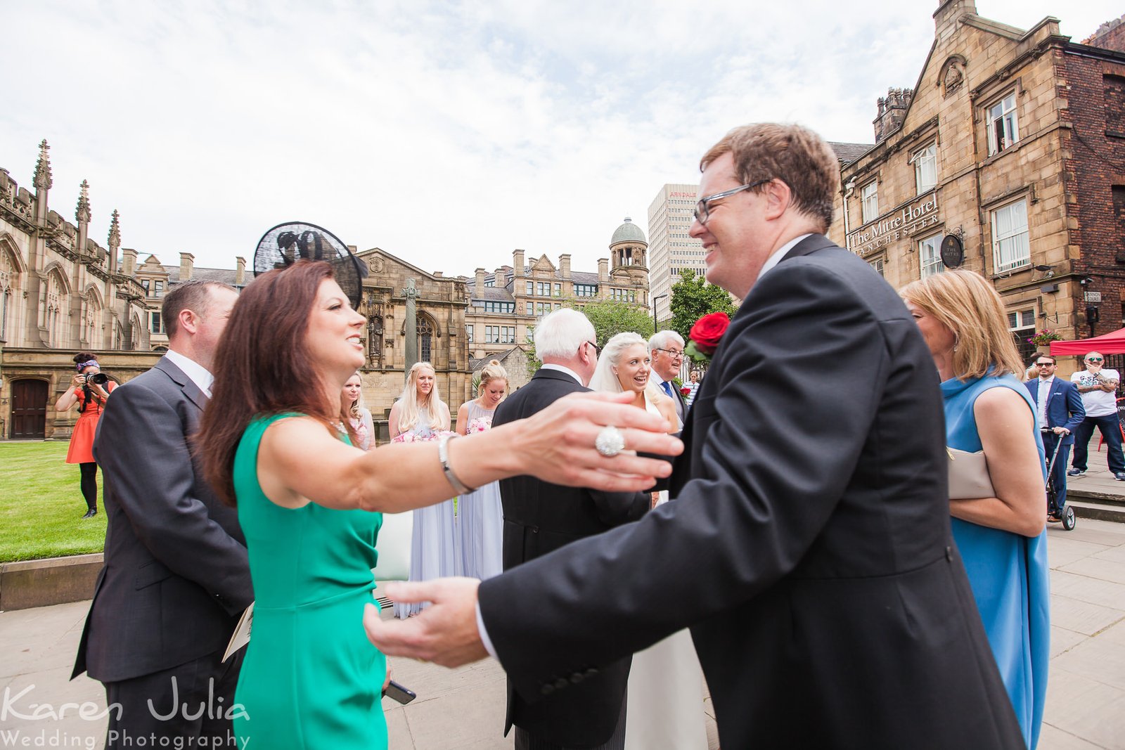 groom greets guests after wedding ceremony