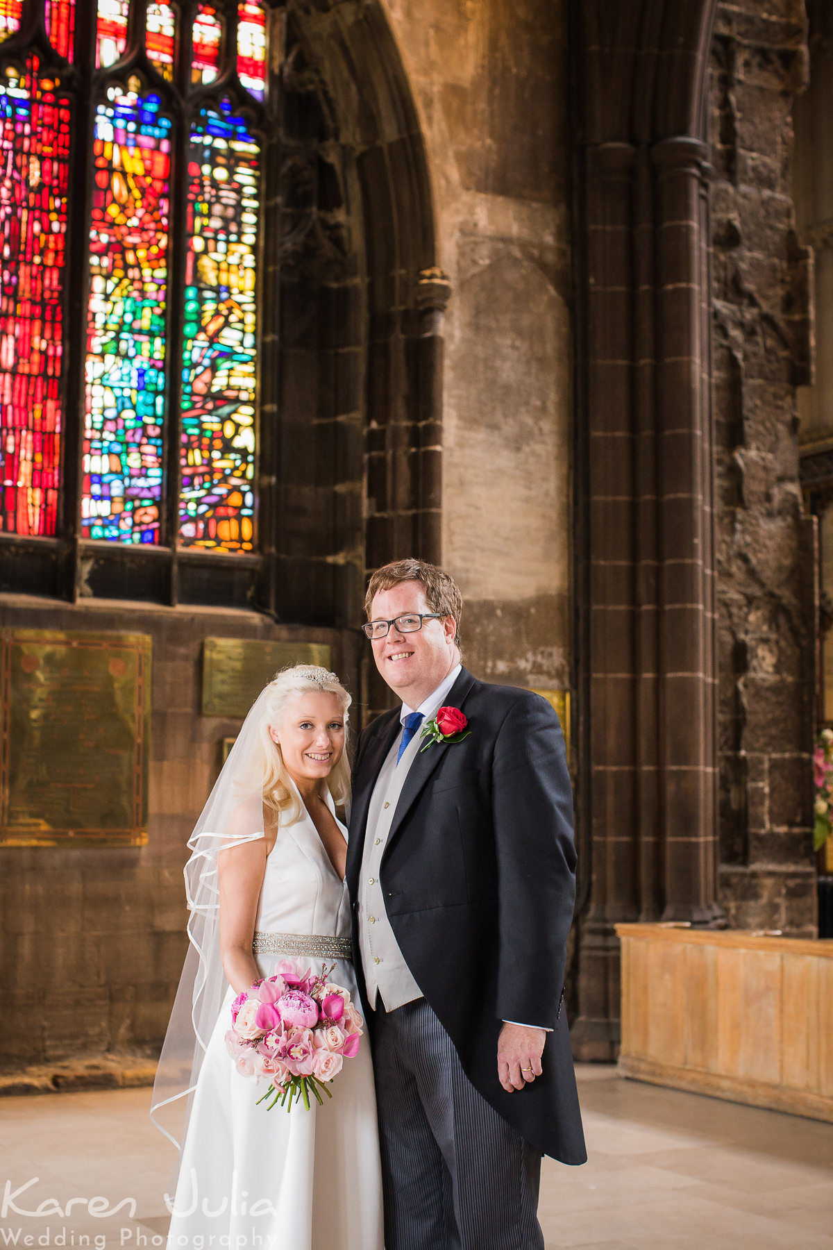 bride and groom wedding day portrait in Manchester Cathedral
