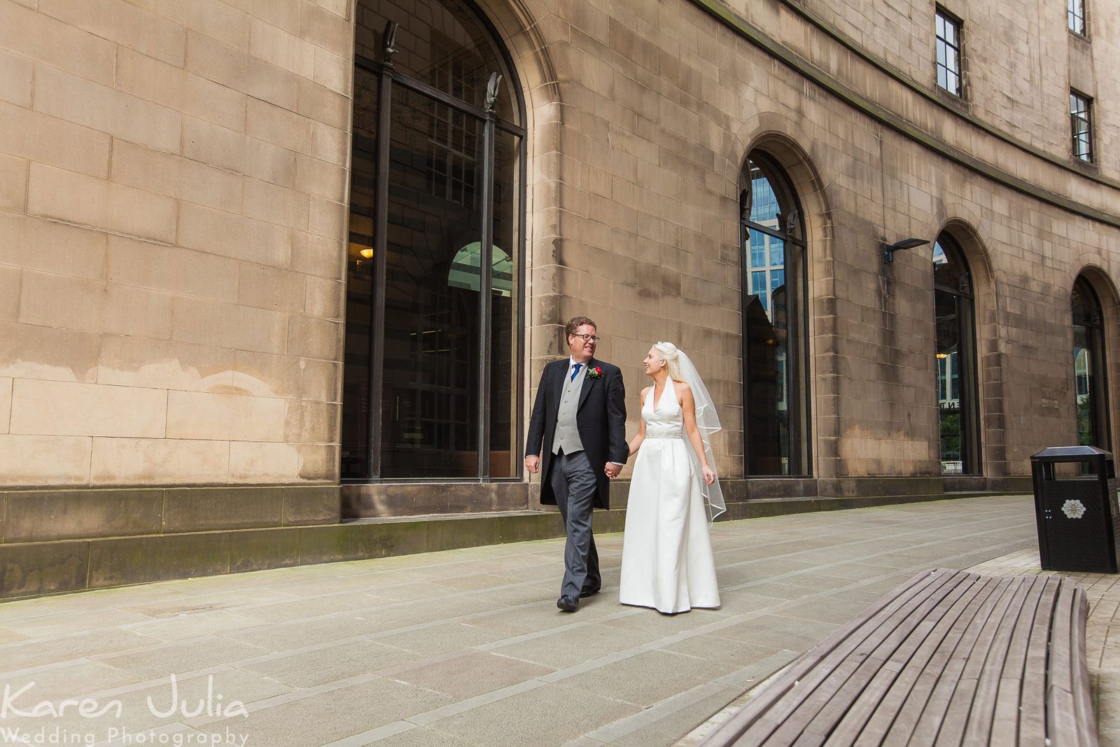 bride and groom in walkway at the newly renovated Central library