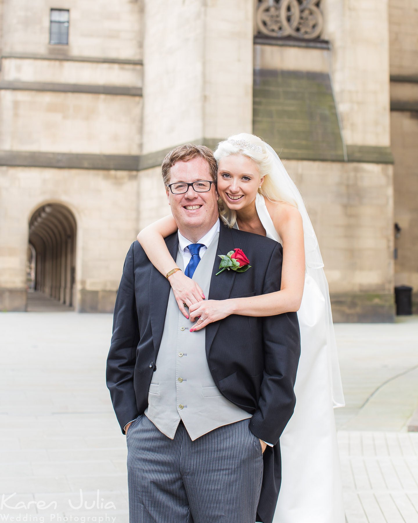 bride and groom portrait outside Manchester Town Hall