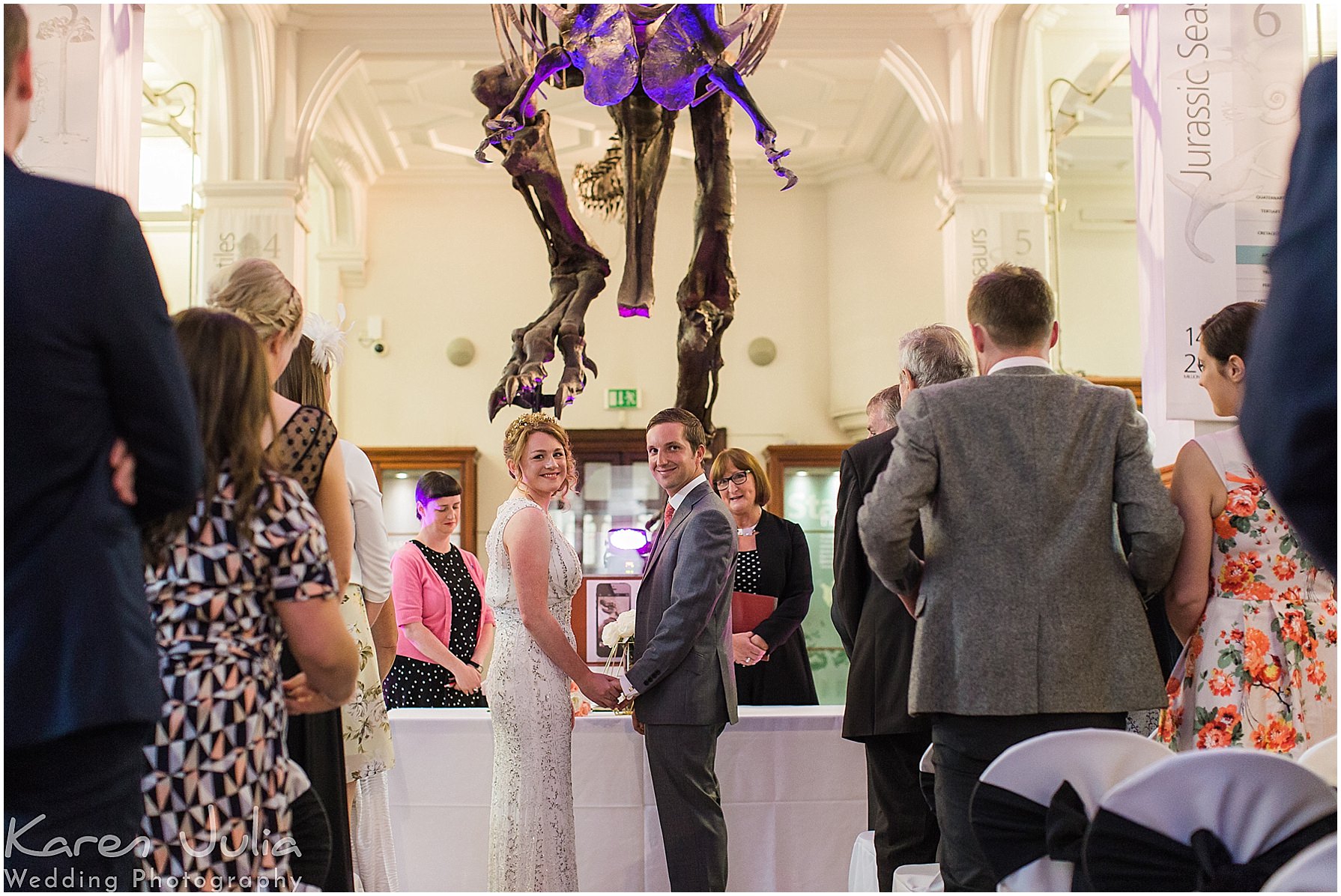 Bride and Groom exchange vows in front of T-Rex