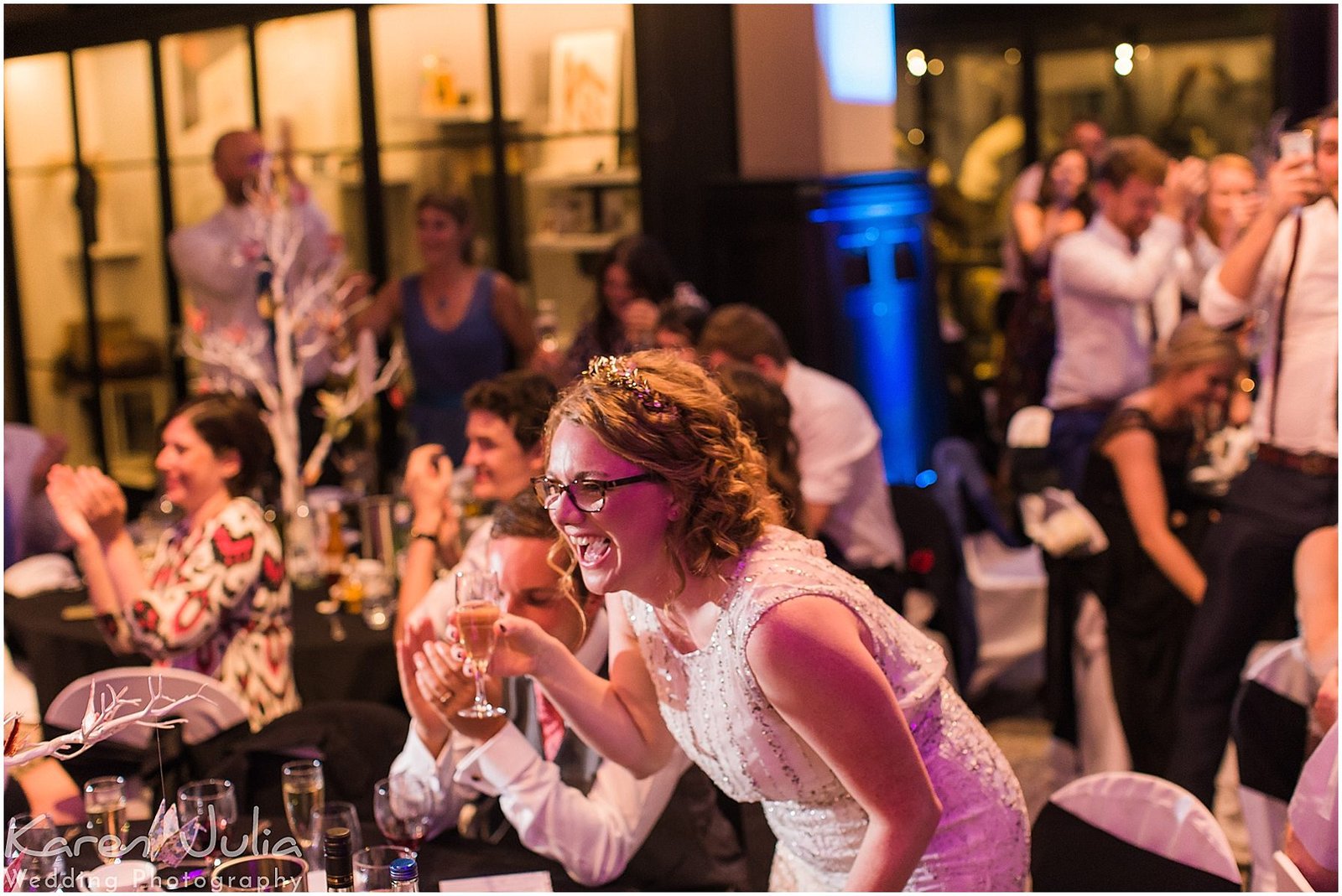 bride laughing during wedding speeches at Manchester Museum