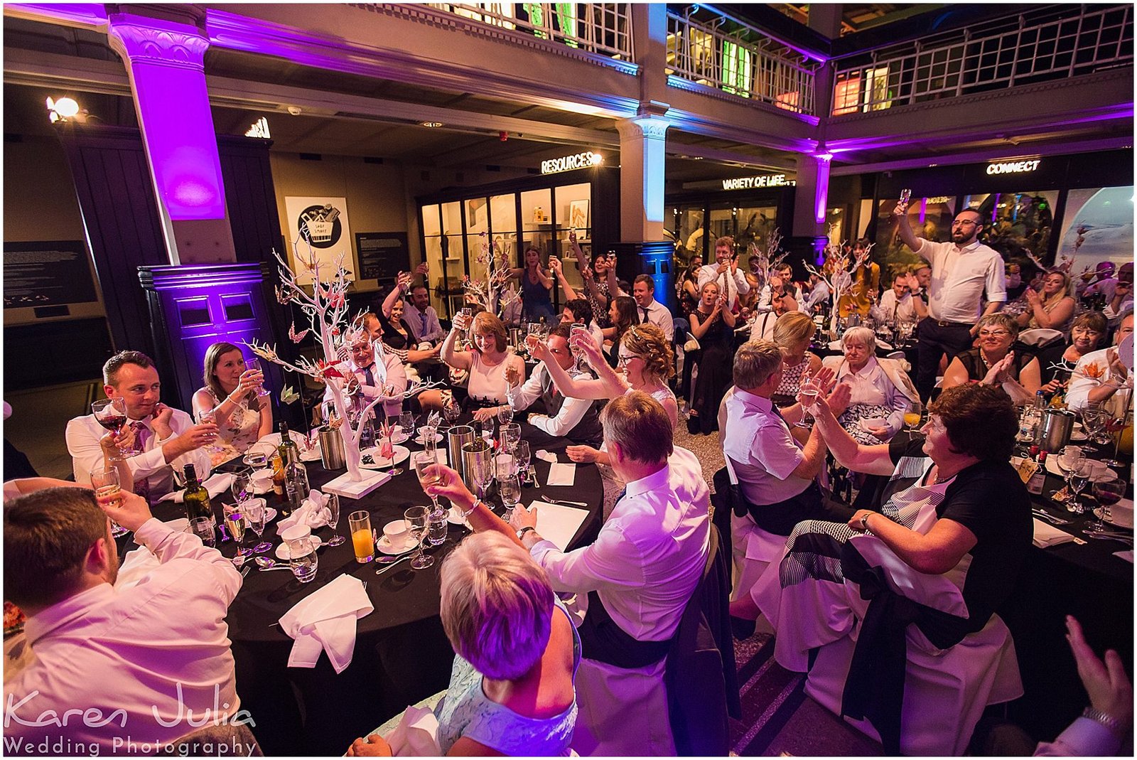 guests clapping wedding speeches at Manchester Museum