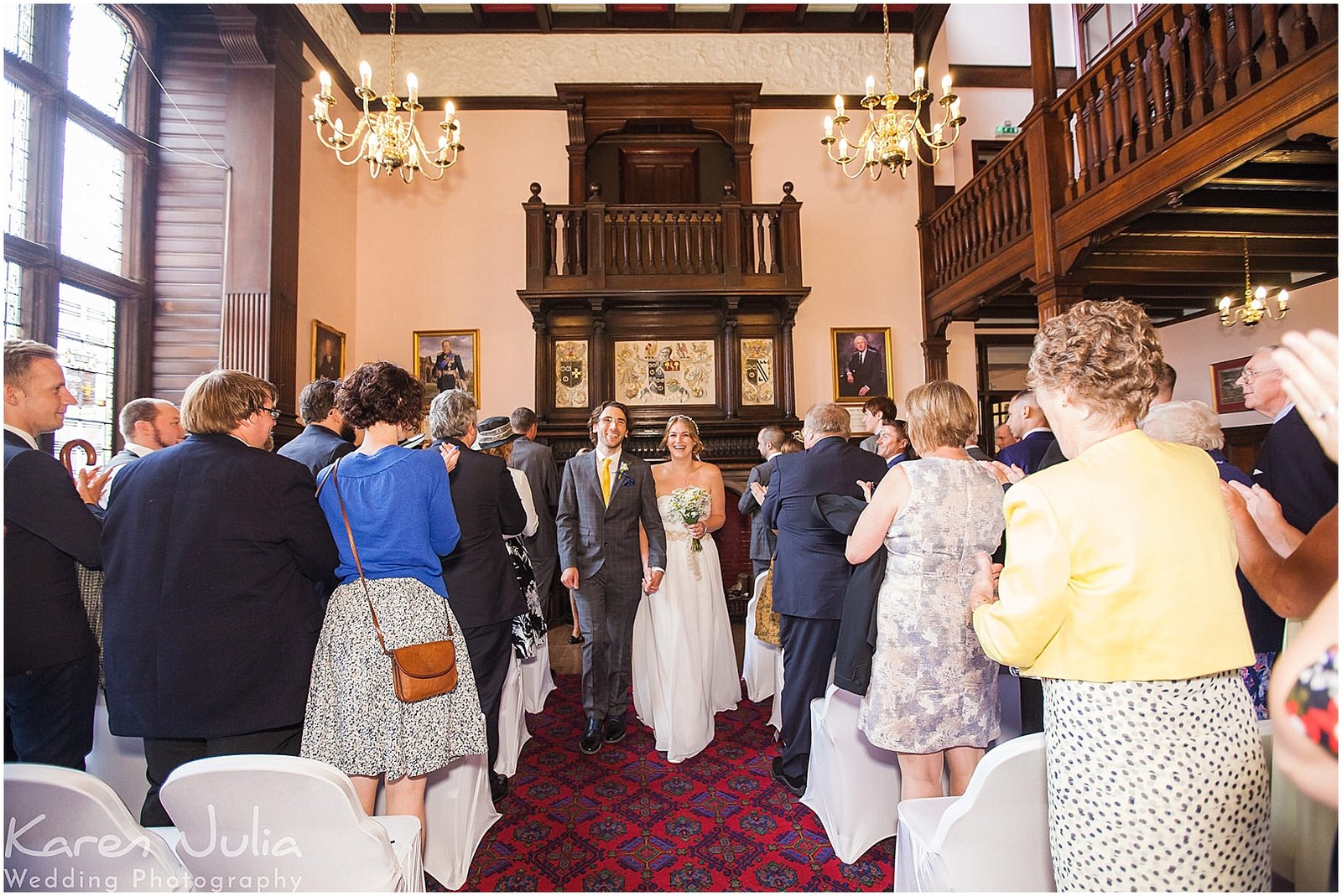 bride and groom walk up aisle together after wedding ceremony