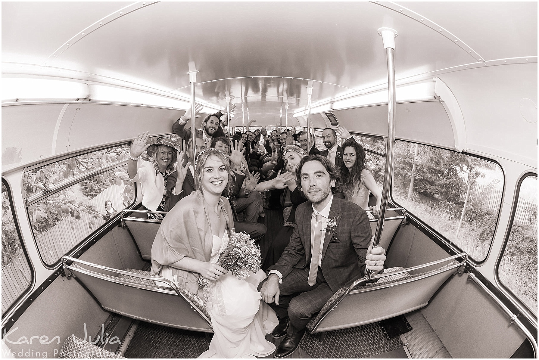 wedding group photo on double decker bus