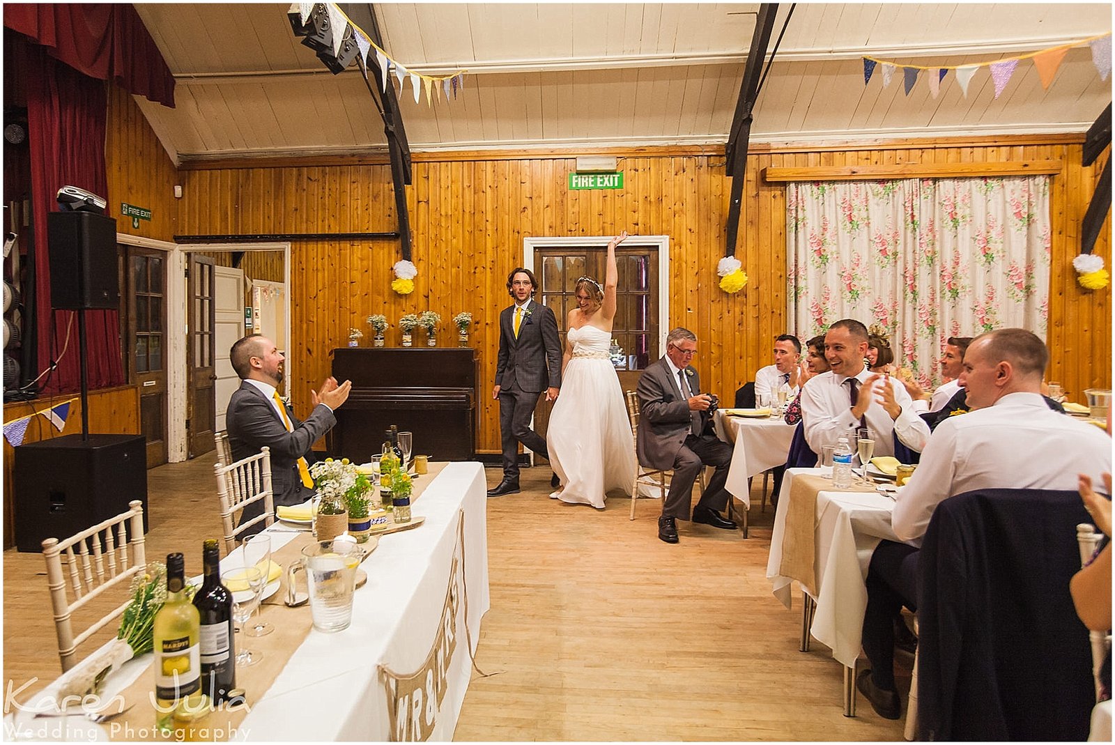 bride and groom make their entrance at Victory Hall Mobberley