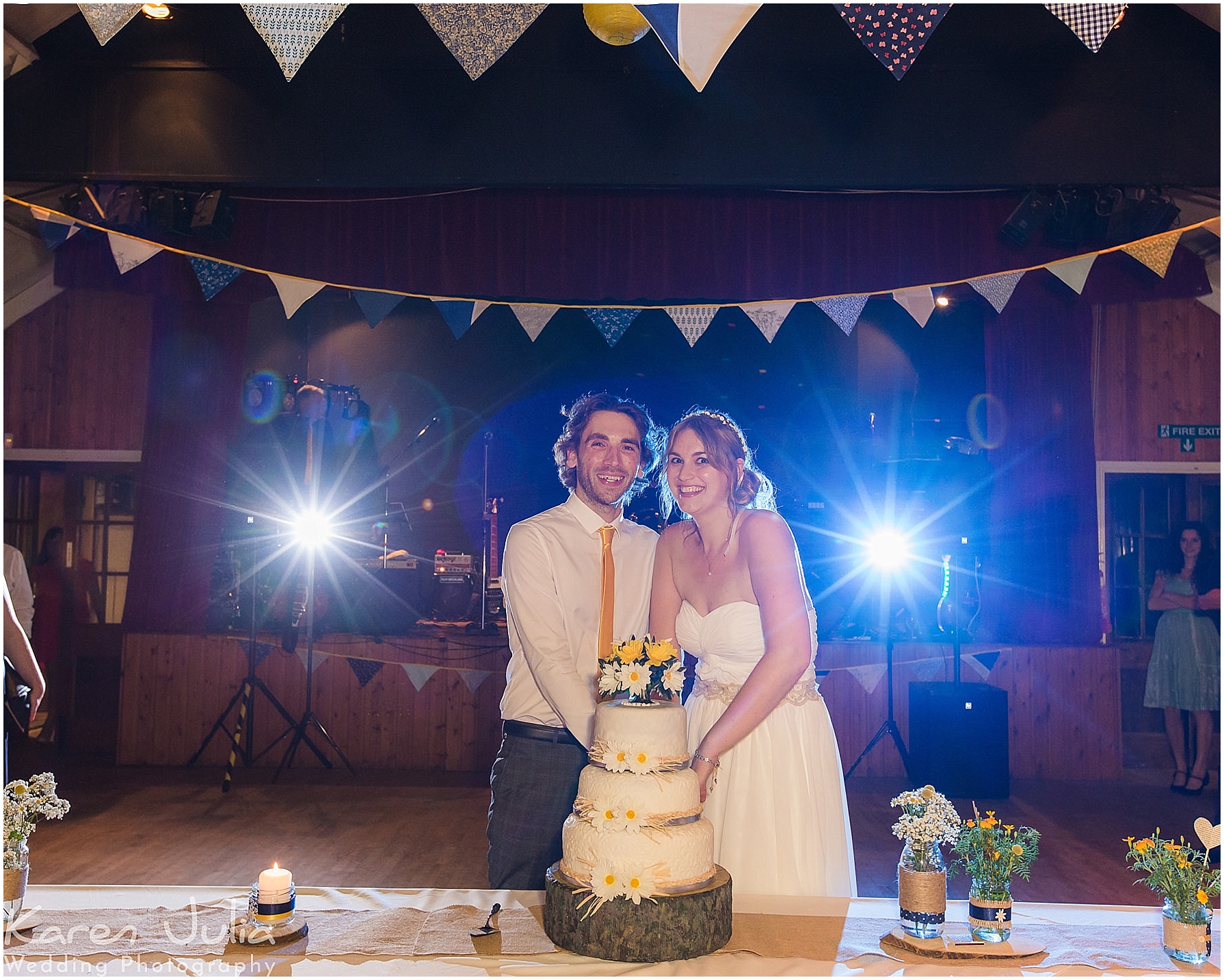 bride and groom cut cake at Victory Hall Mobberley