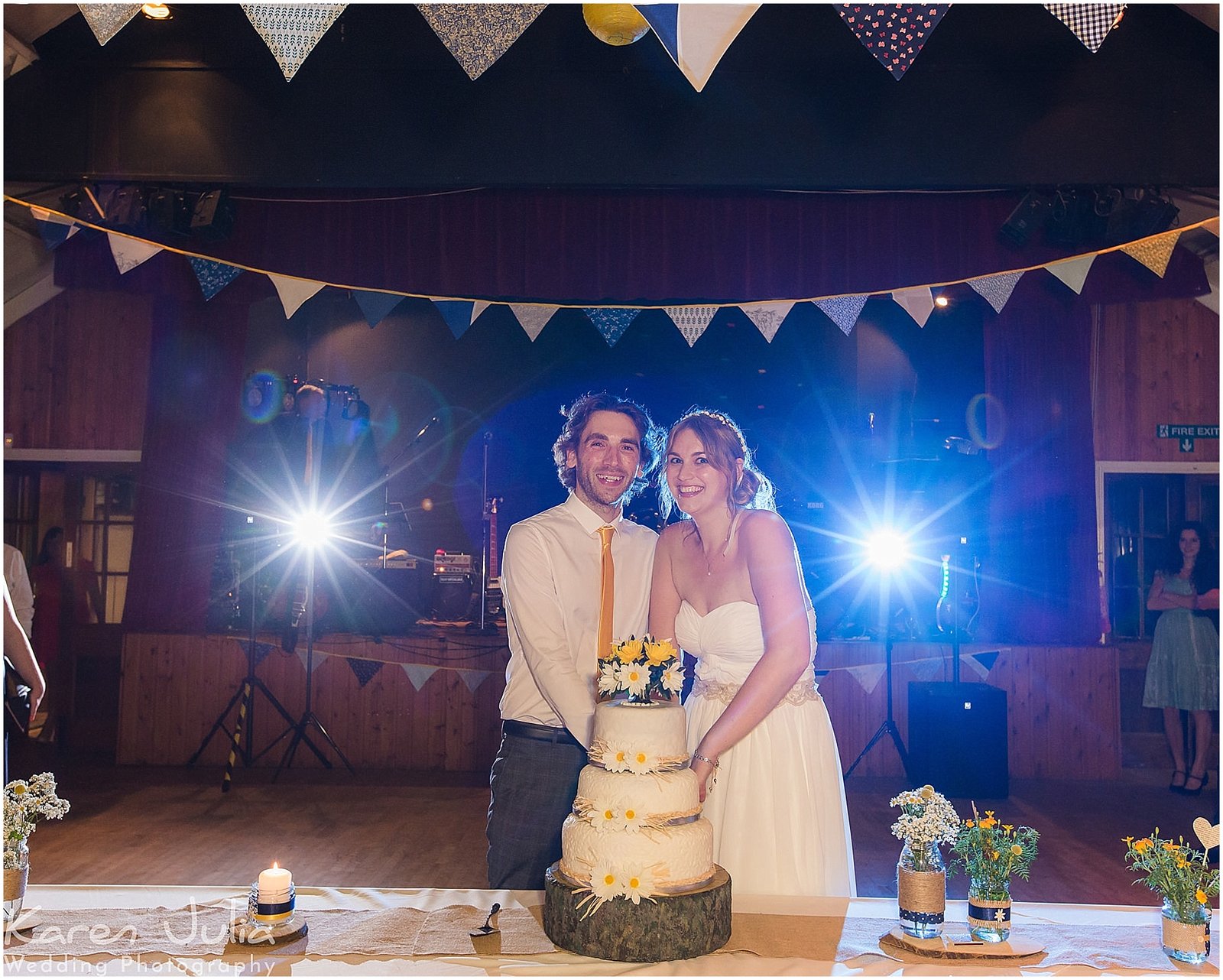 bride and groom cut cake at Victory Hall Mobberley