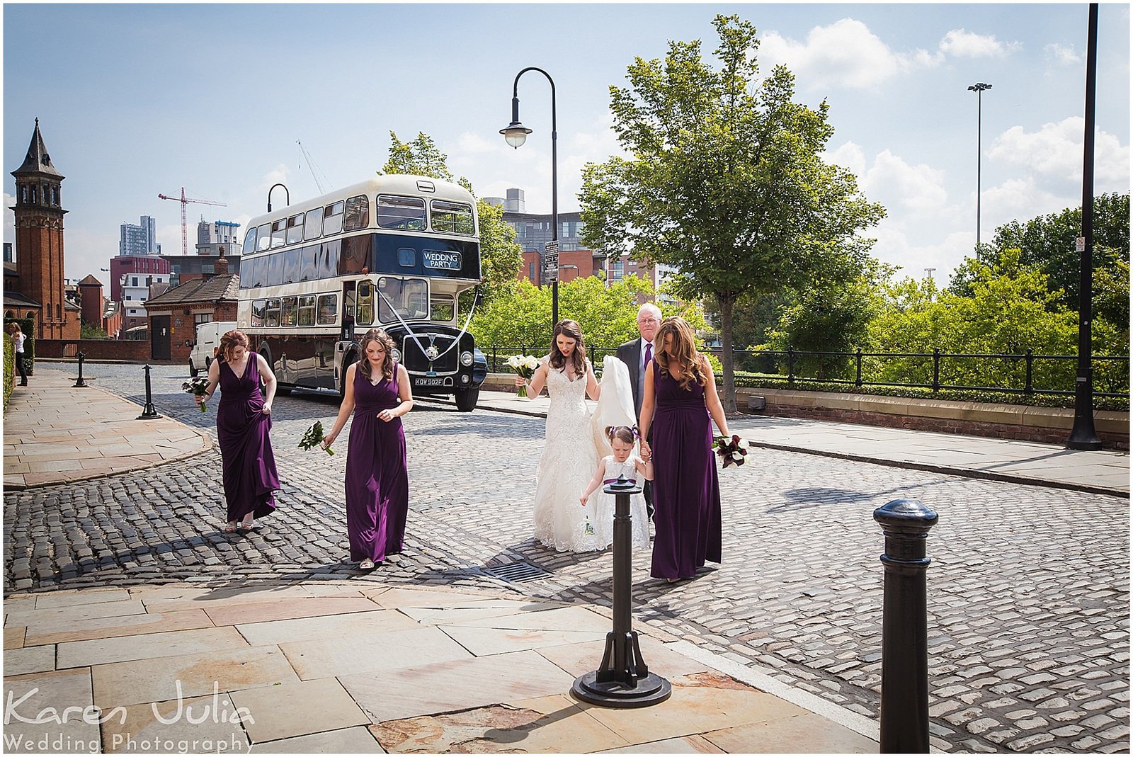 bride and bridesmaids walk toward Castlefield Rooms for wedding ceremony