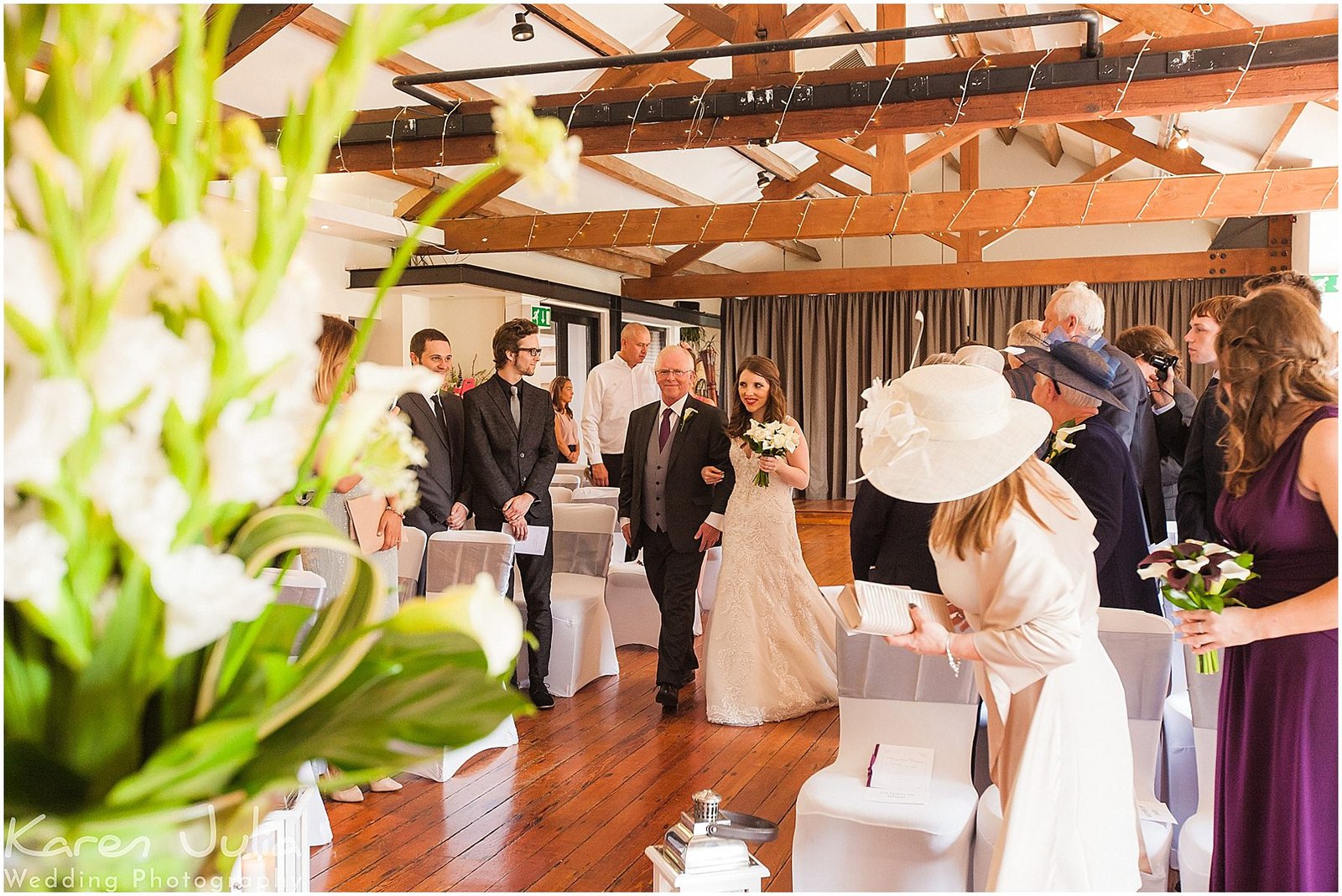 bride and father walk down aisle in the brindley Room in Castlefield rooms