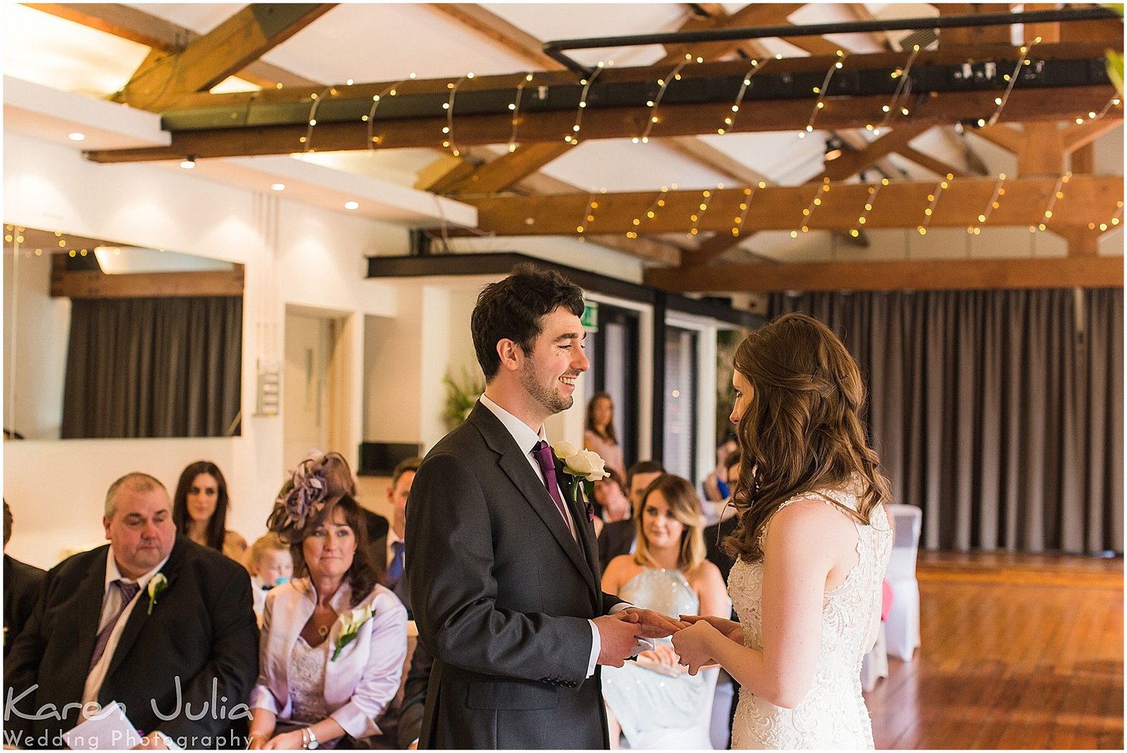 bride and groom exchange rings in the Brindley Room in Castlefield Rooms