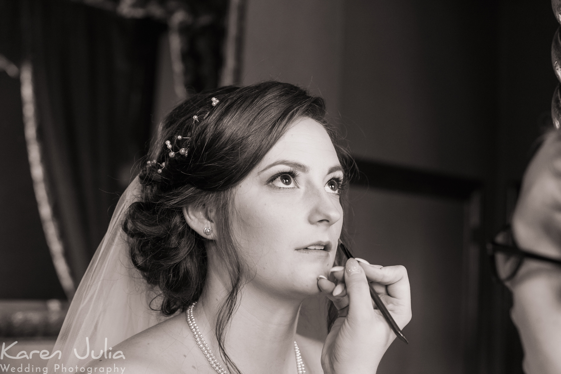 bride getting make-up applied at Crewe Hall