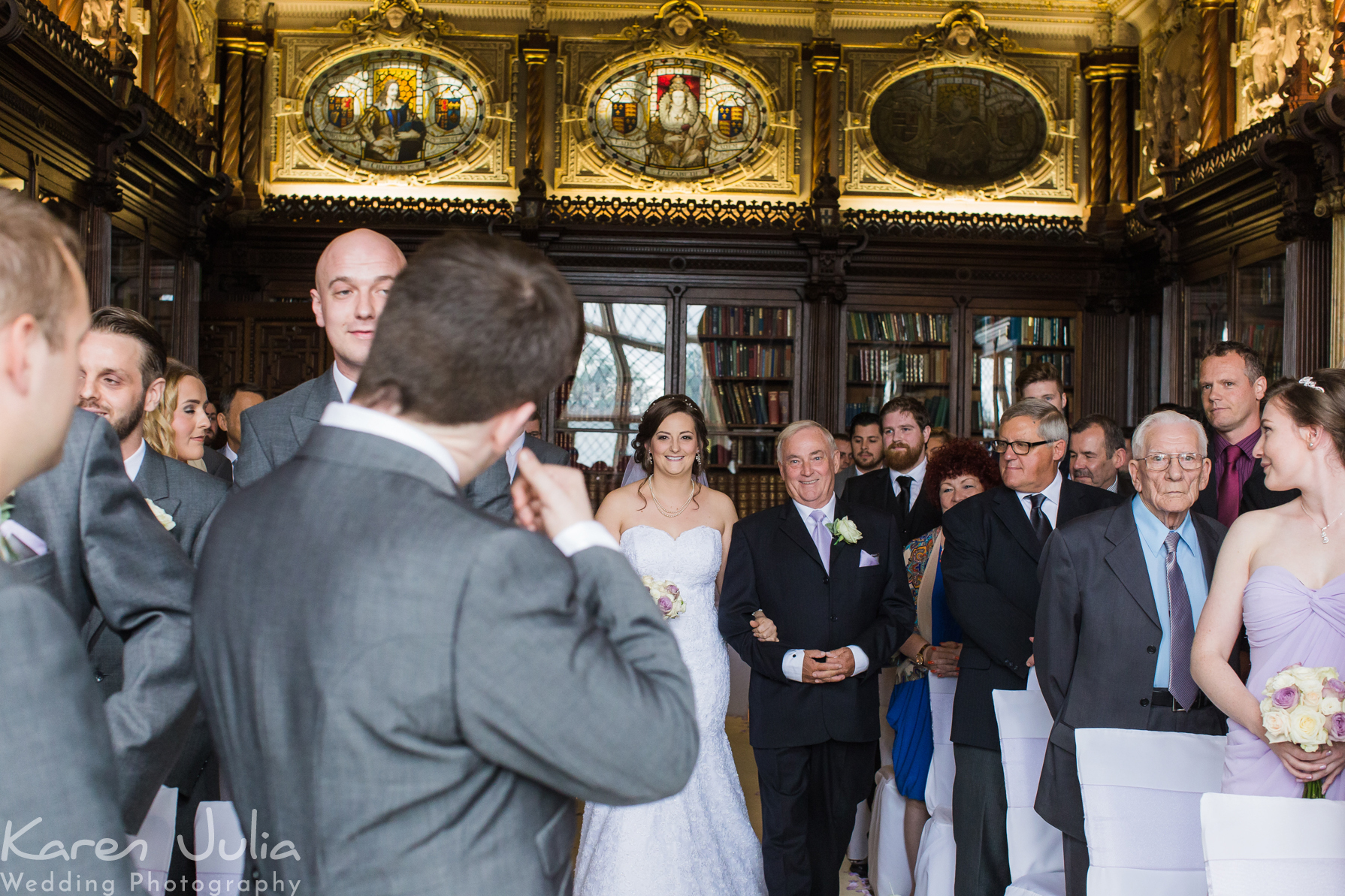 bride walking down aisle with her dad at Crewe Hall