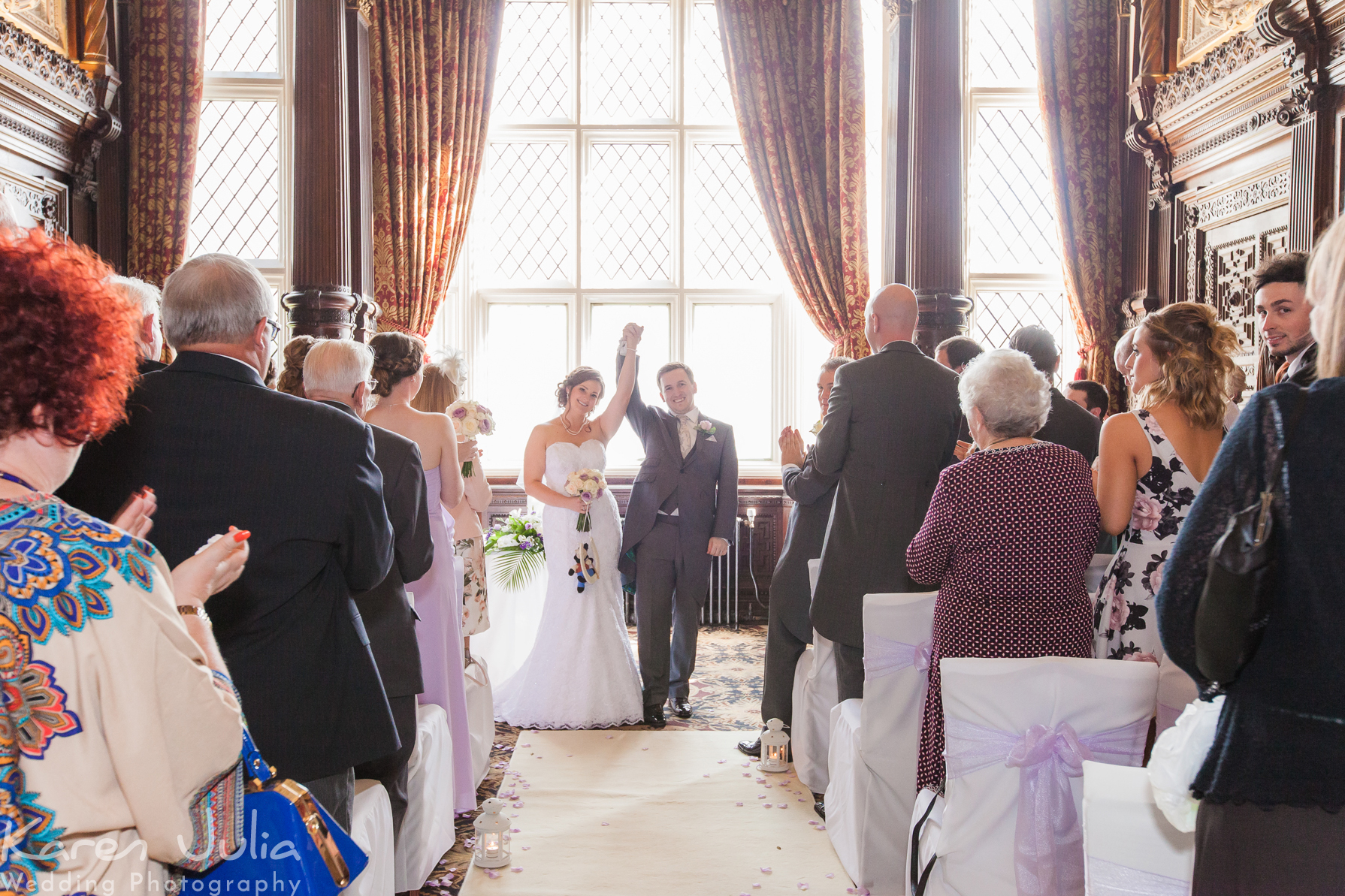 bride and groom celebrate getting married after wedding ceremony at Crewe Hall
