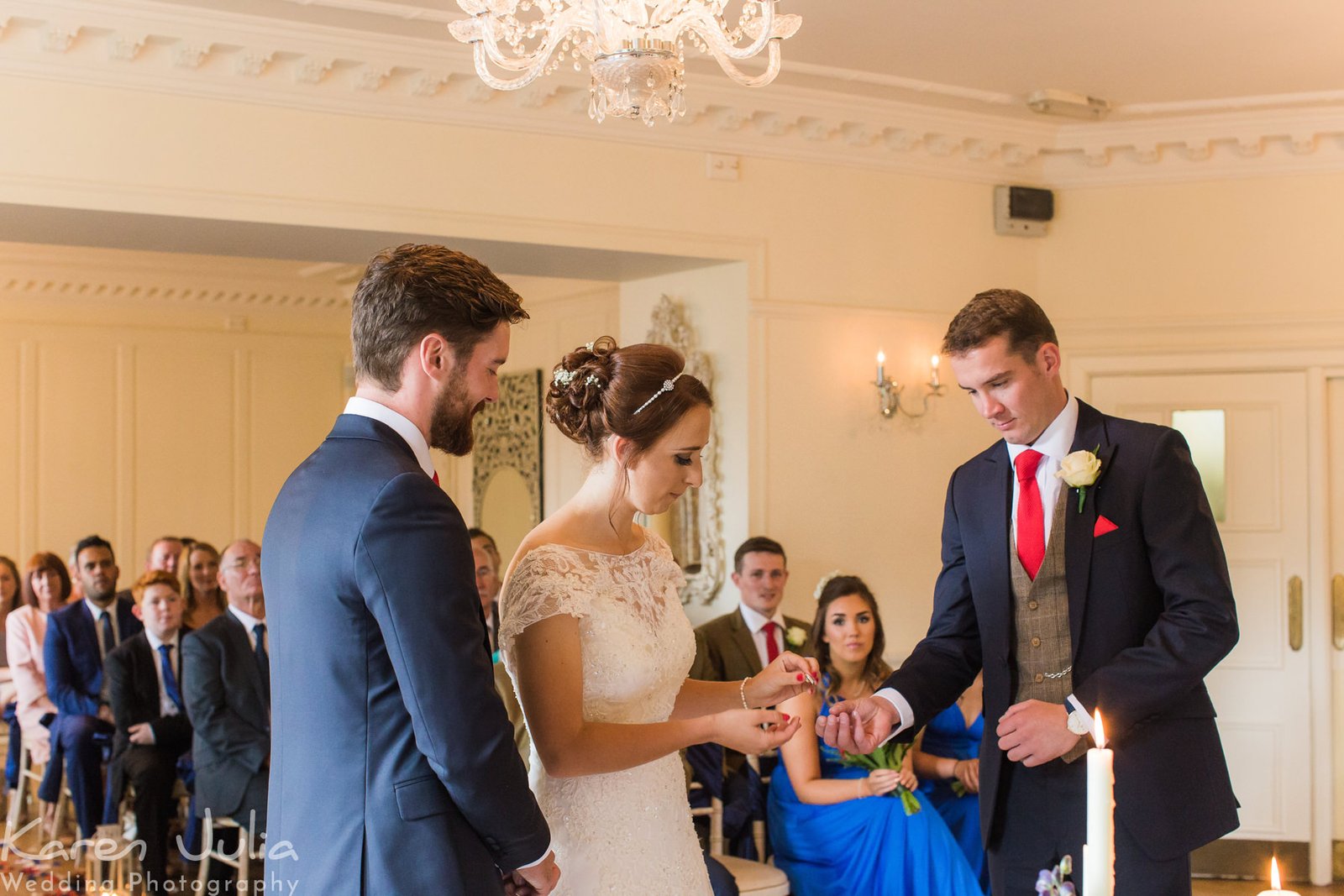 bride and groom exchange wedding rings