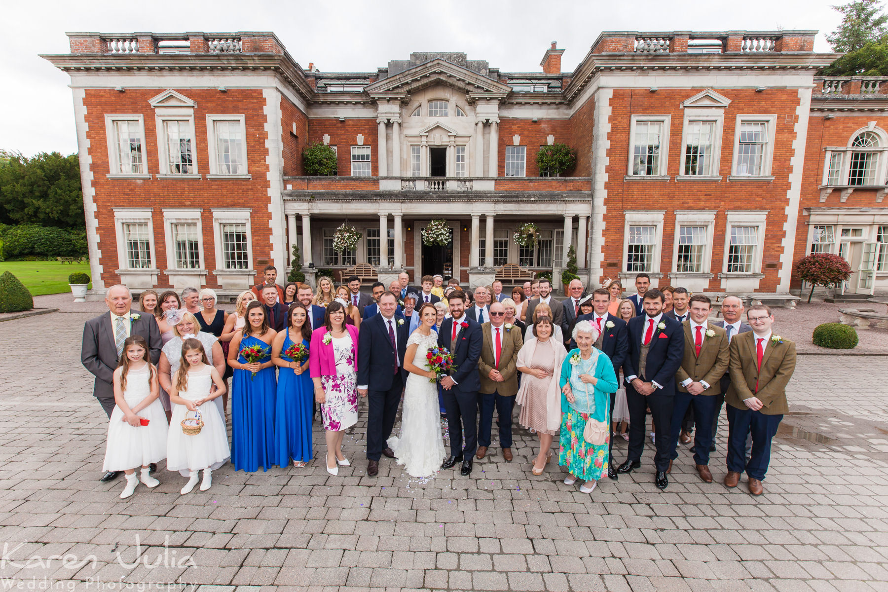 group photo of all guests at Eaves Hall wedding
