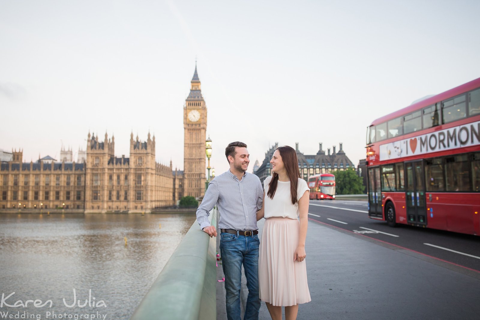 couple pose for portrait on Westminster Bridge during their London Sunrise Pre-Wedding Photography