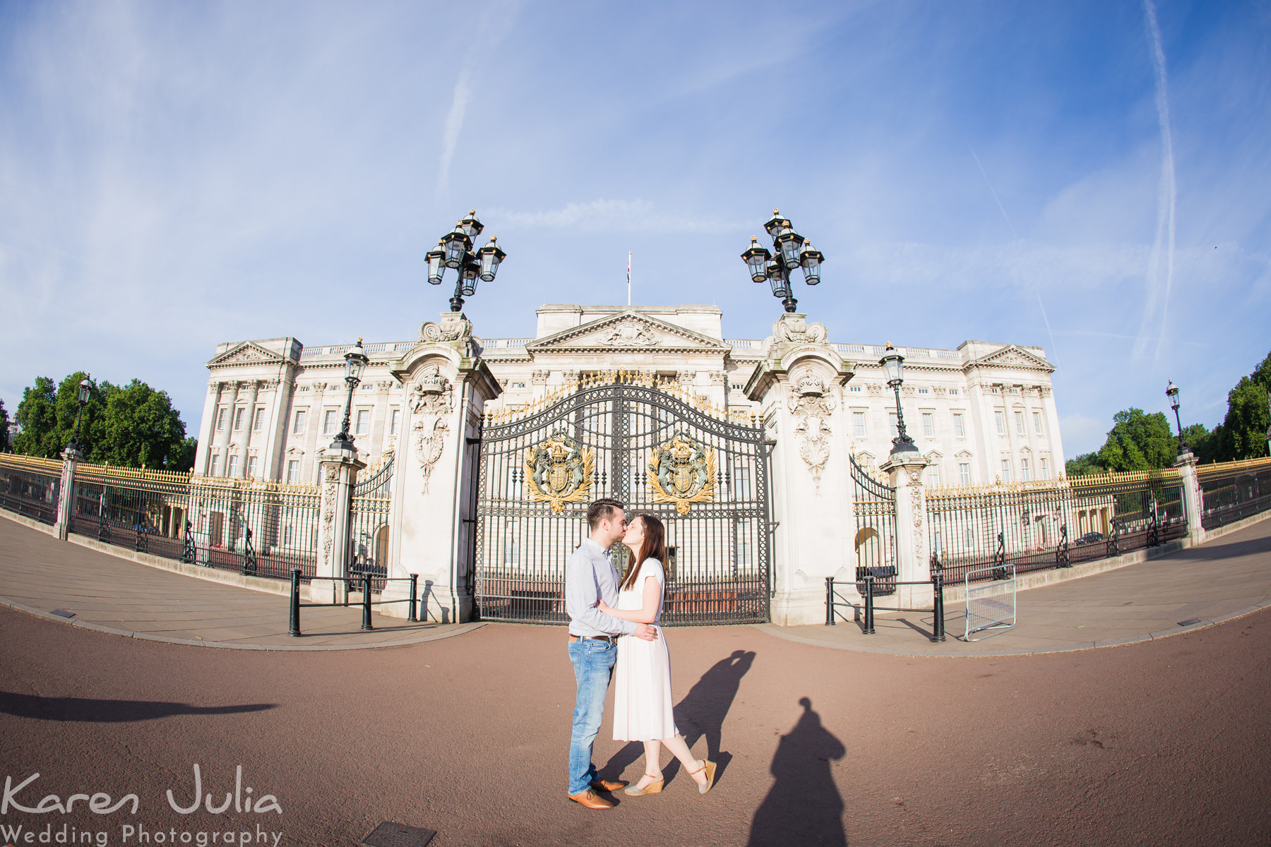 couple portrait in front of Buckingham Palace during their London pre-wedding shoot