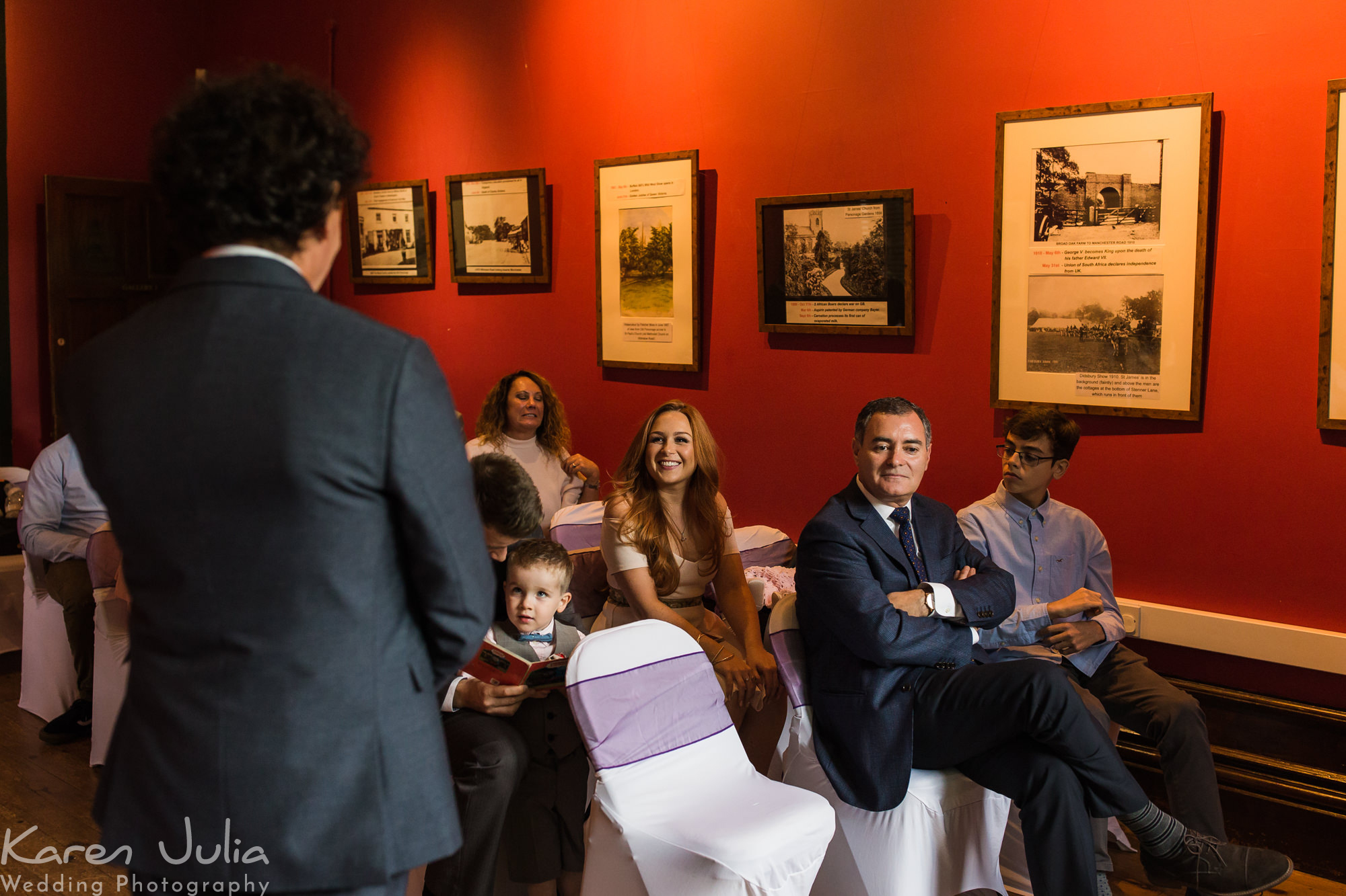 groom waits on bride with guests at the old parsonage