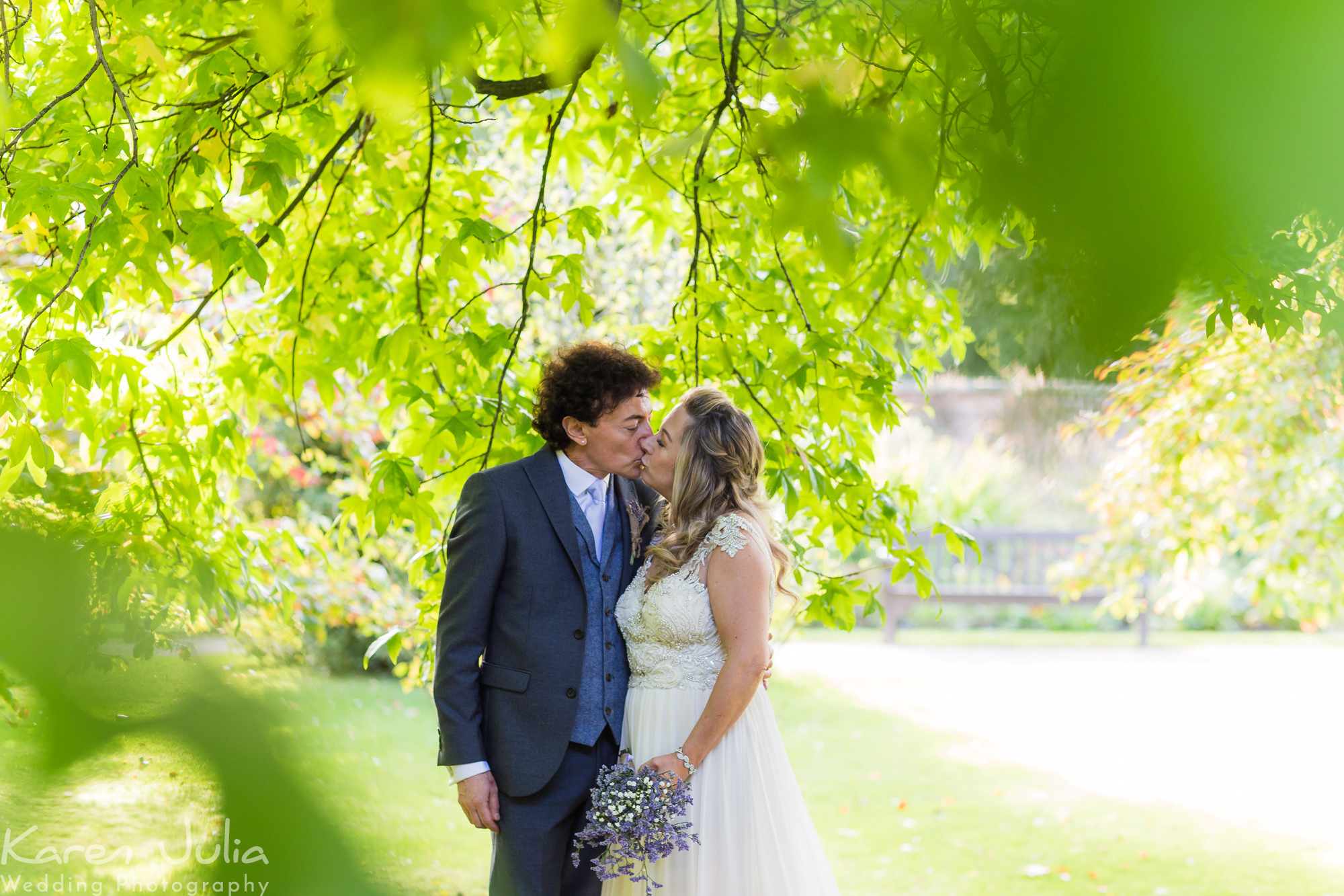 bride and groom portraits in the gardens at the old parsonage in Didsbury