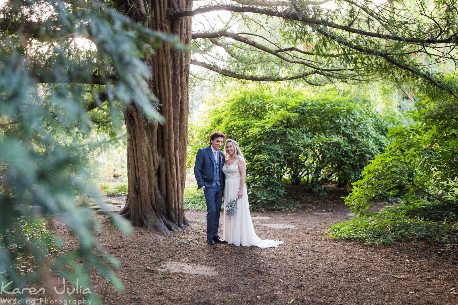 bride and groom in Parsonage gardens at their Rustic Didsbury Parsonage Wedding