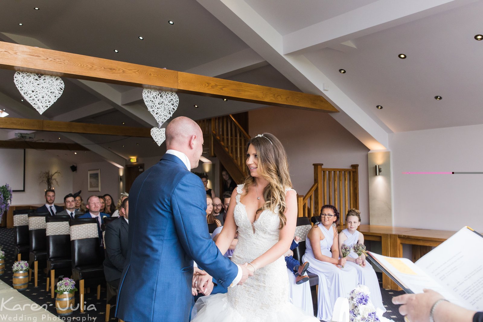 bride and groom hold hands before their wedding ceremony