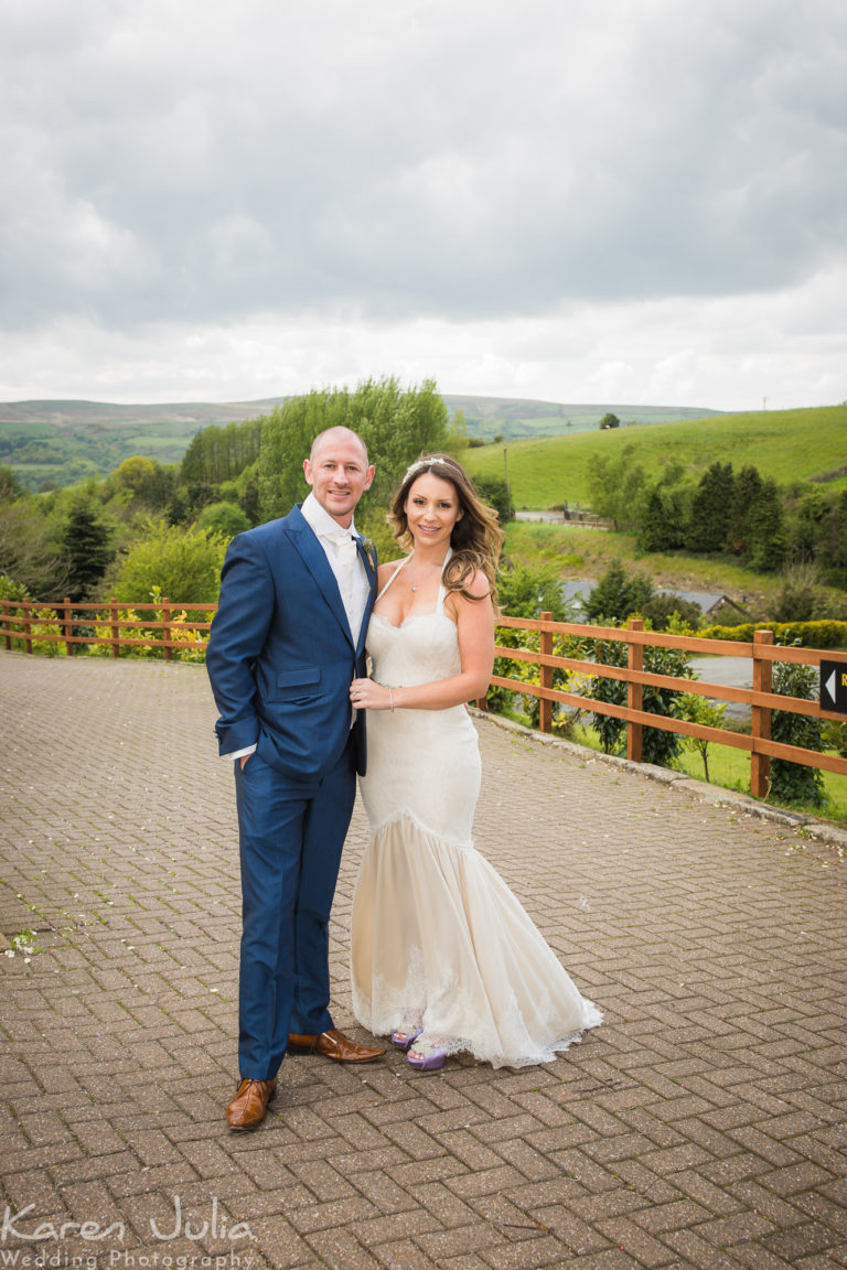 bride and groom pose for a portrait at their The Fisherman's Retreat Rustic Spring Wedding