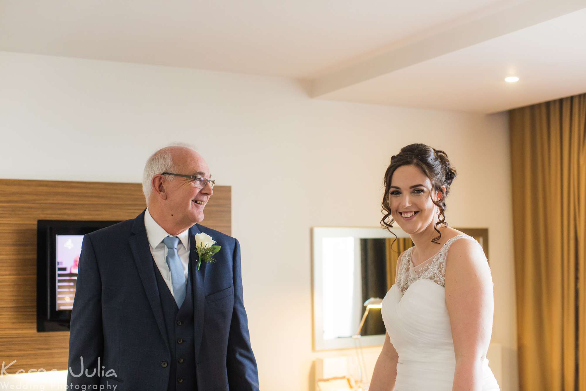 brides dad sees her in her dress before her Lowry Theatre wedding