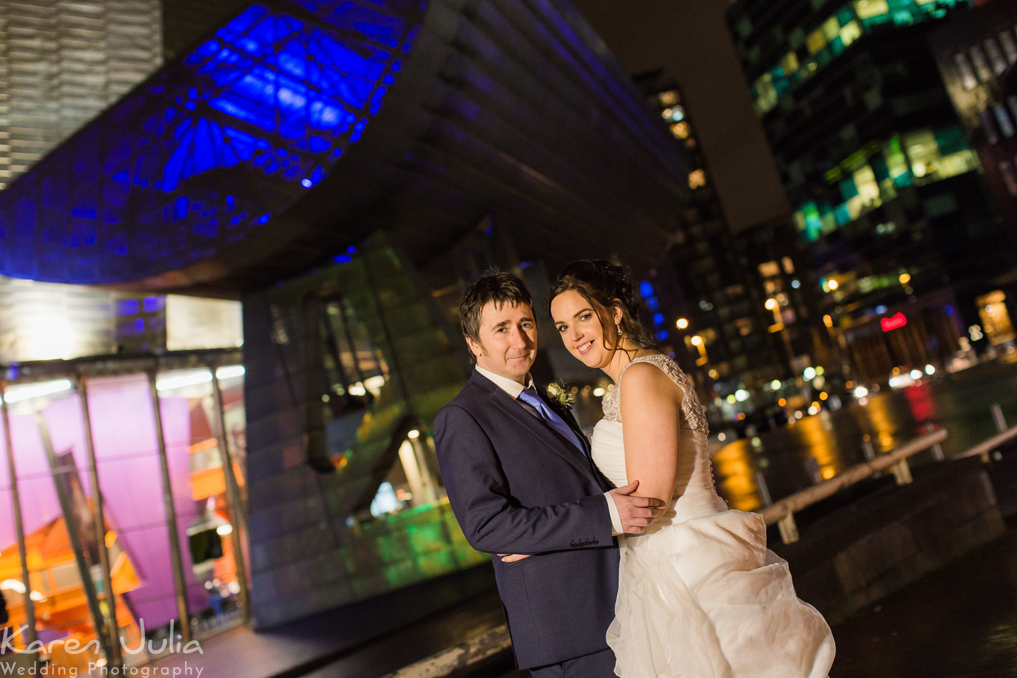bride and groom night portrait outside the Lowry Theatre