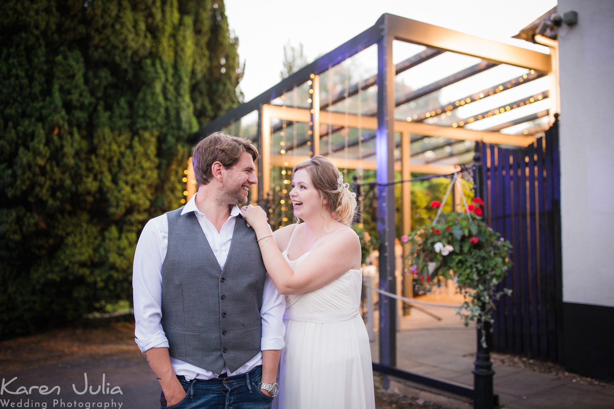 bride and groom dusk portrait in the gardens at the Deanwater Hotel