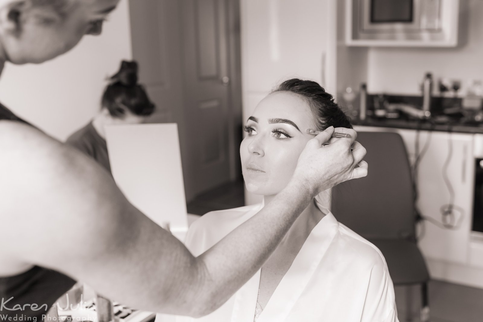 make-up being applied during morning bridal preparations