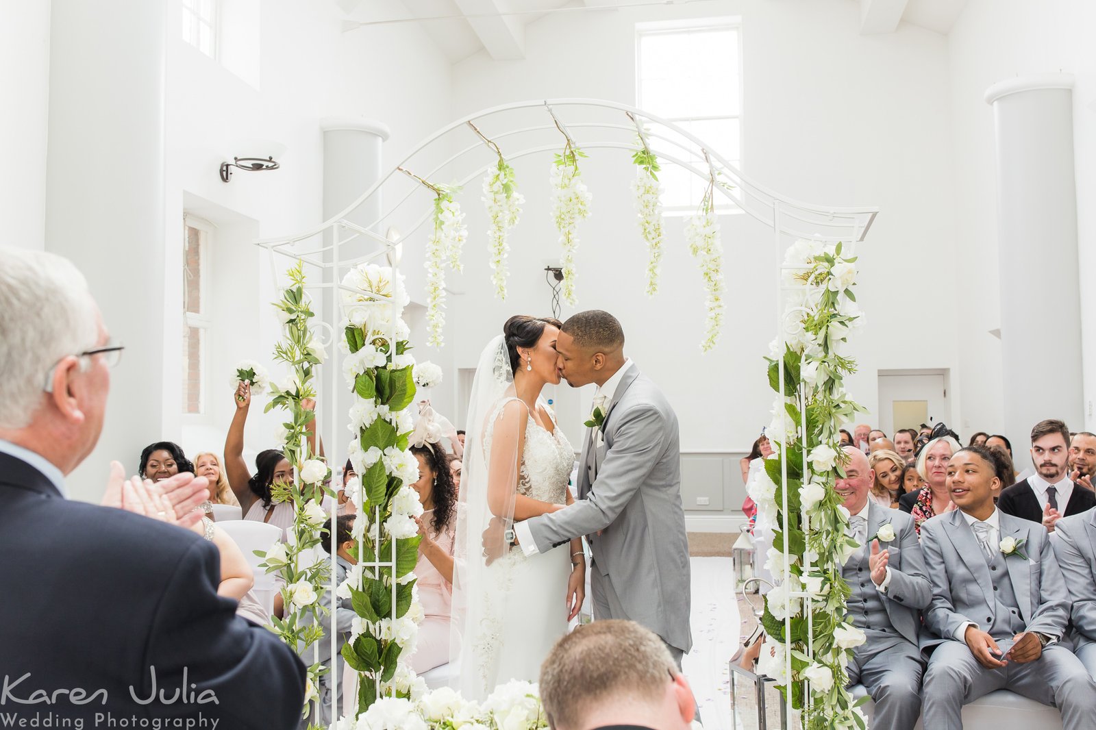 bride and groom kiss at the end of their wedding ceremony at Chancellors Hotel