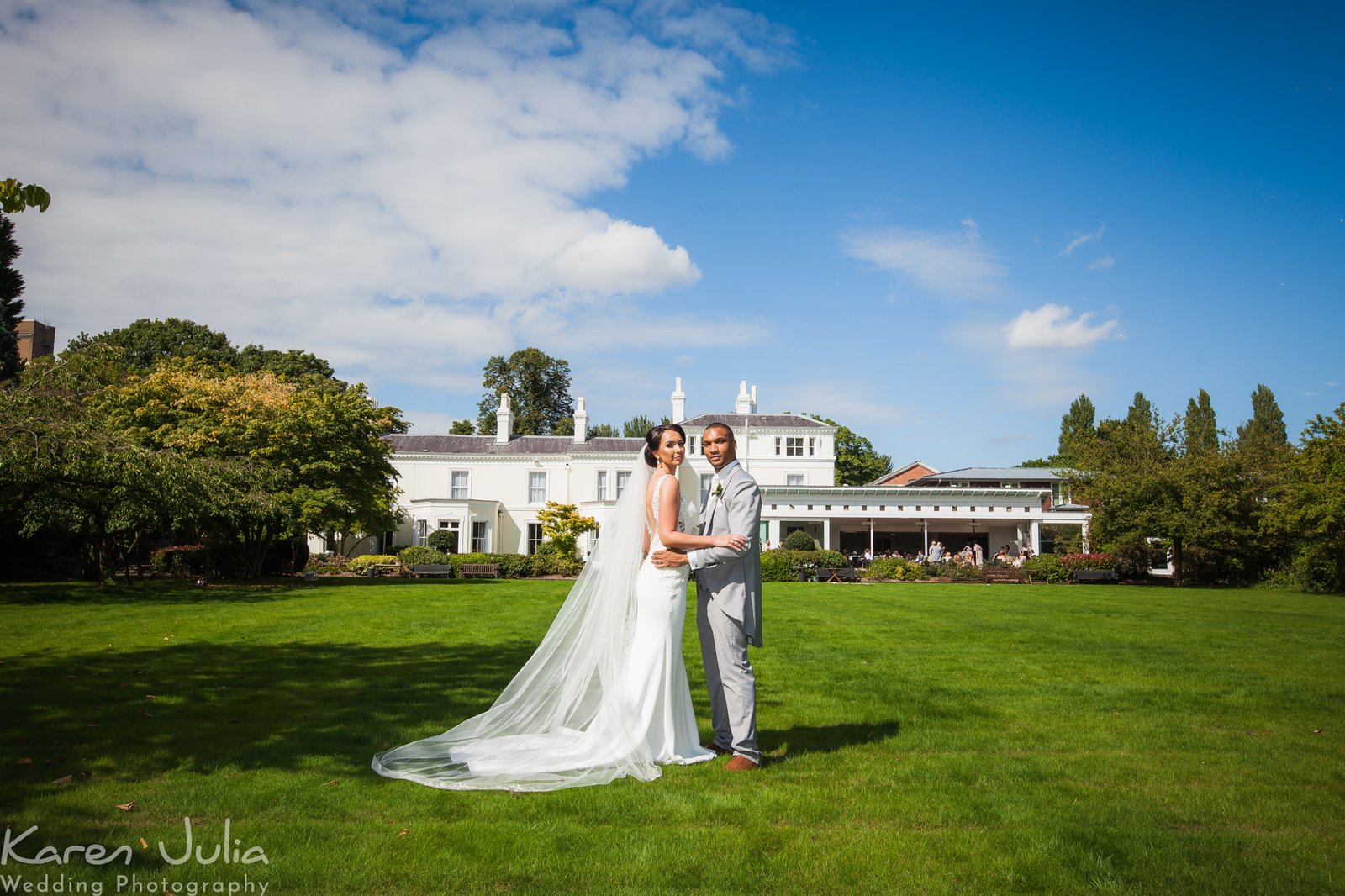 bride and groom portrait with Chancellors Hotel in the background