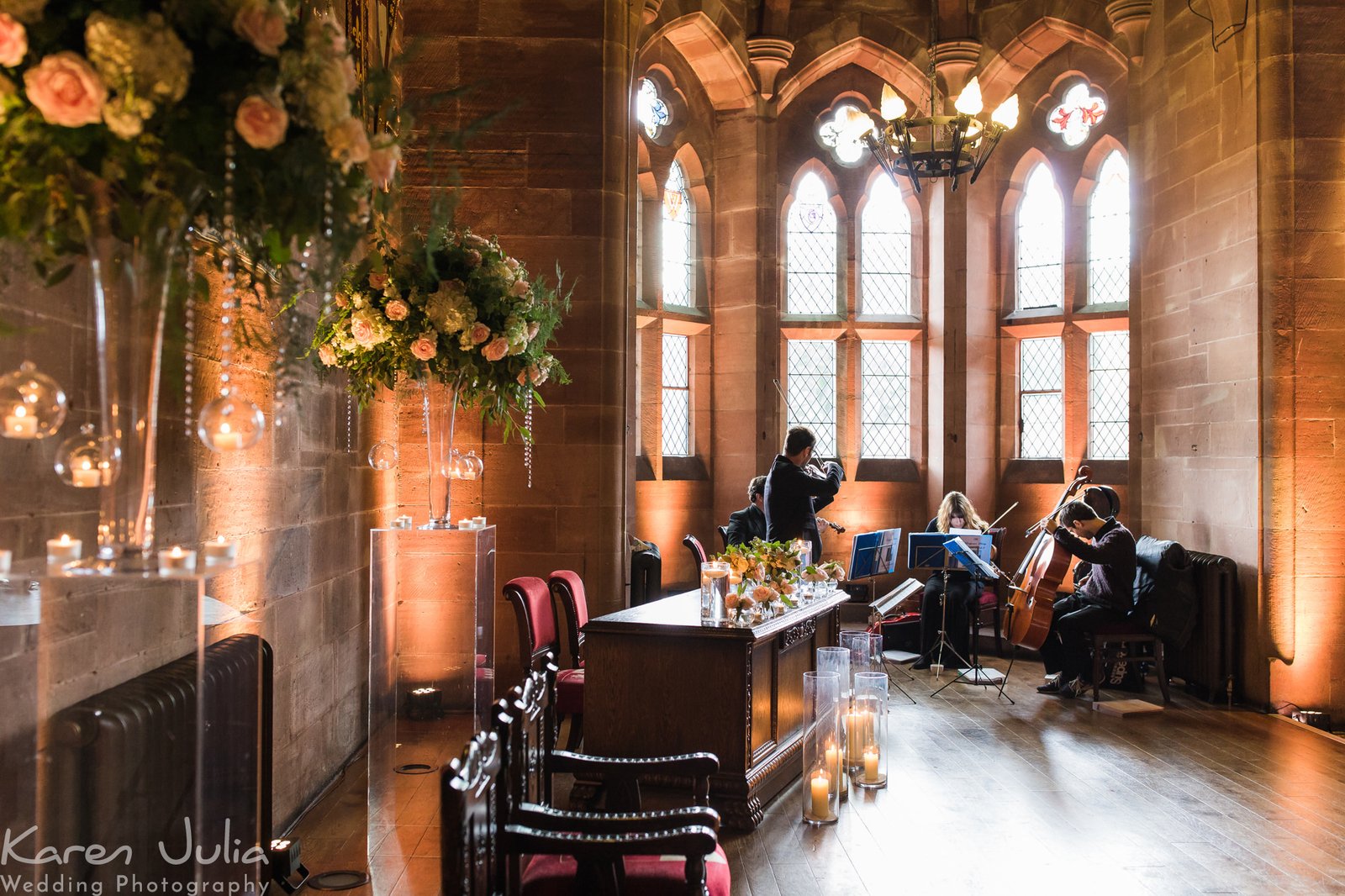 string quartet prepare in the Great Hall at Peckforton Castle