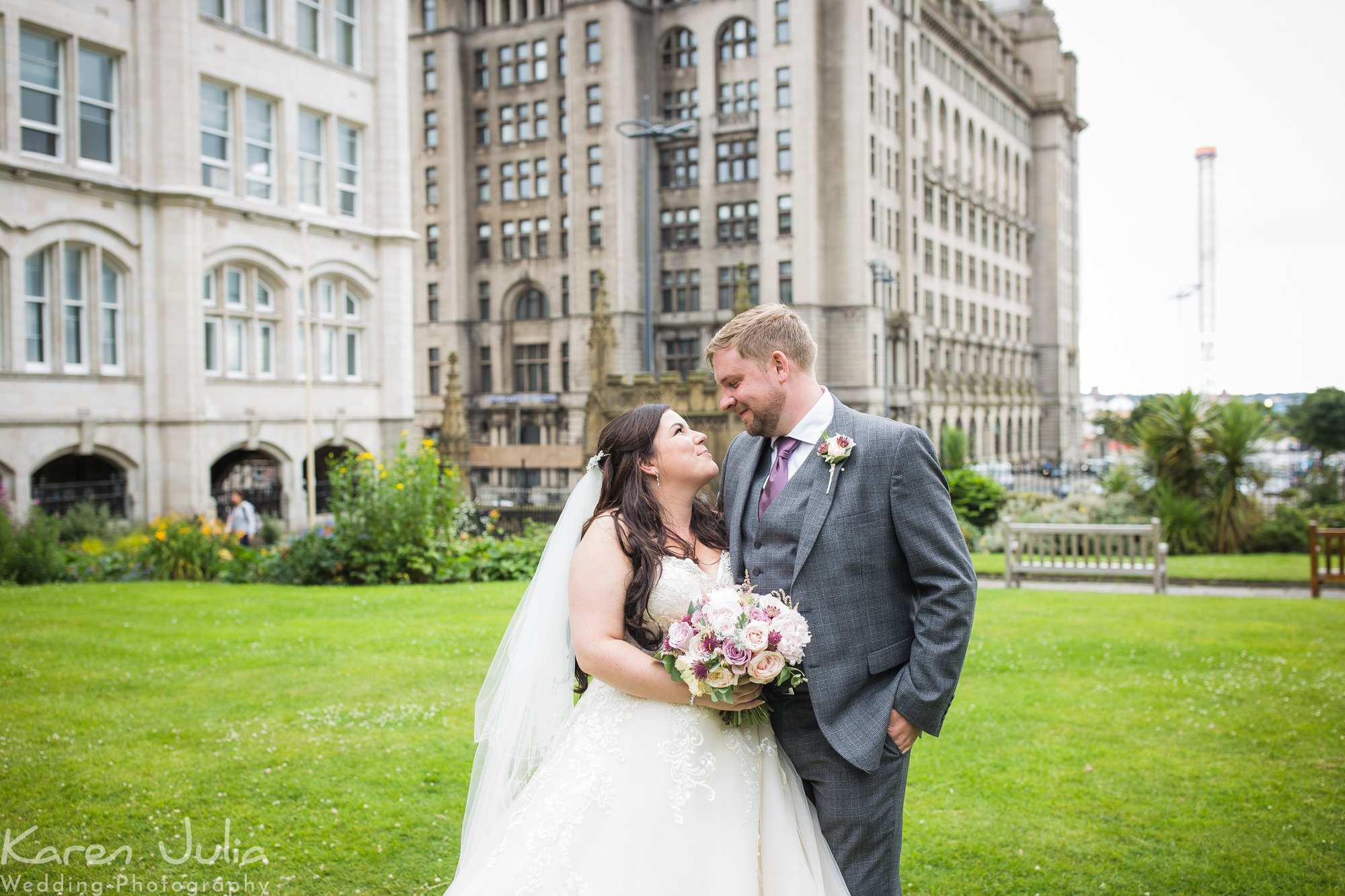 bride and groom portrait with the Royal Liver building in the background