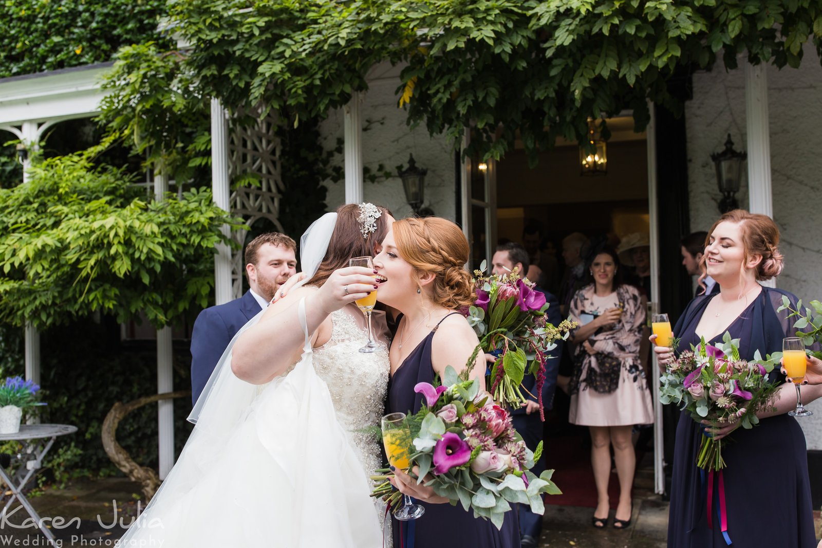 couple greet guests outside Statham Lodge hotel