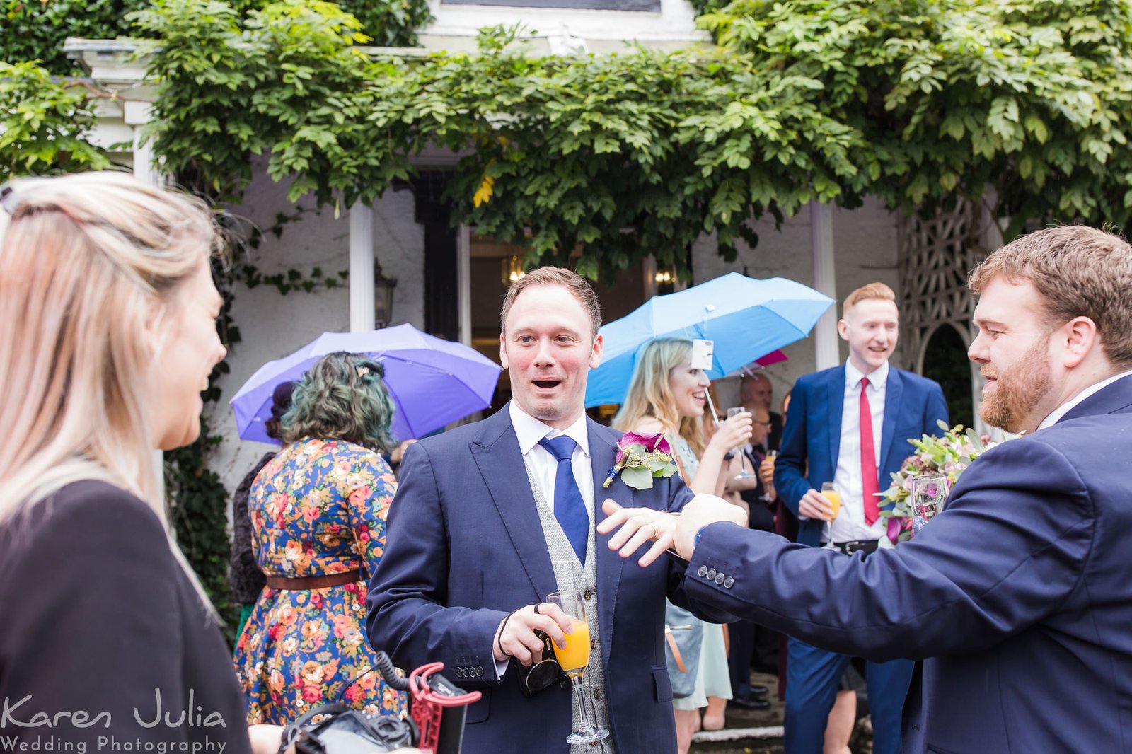 couple mingle with guests outside Statham Lodge hotel