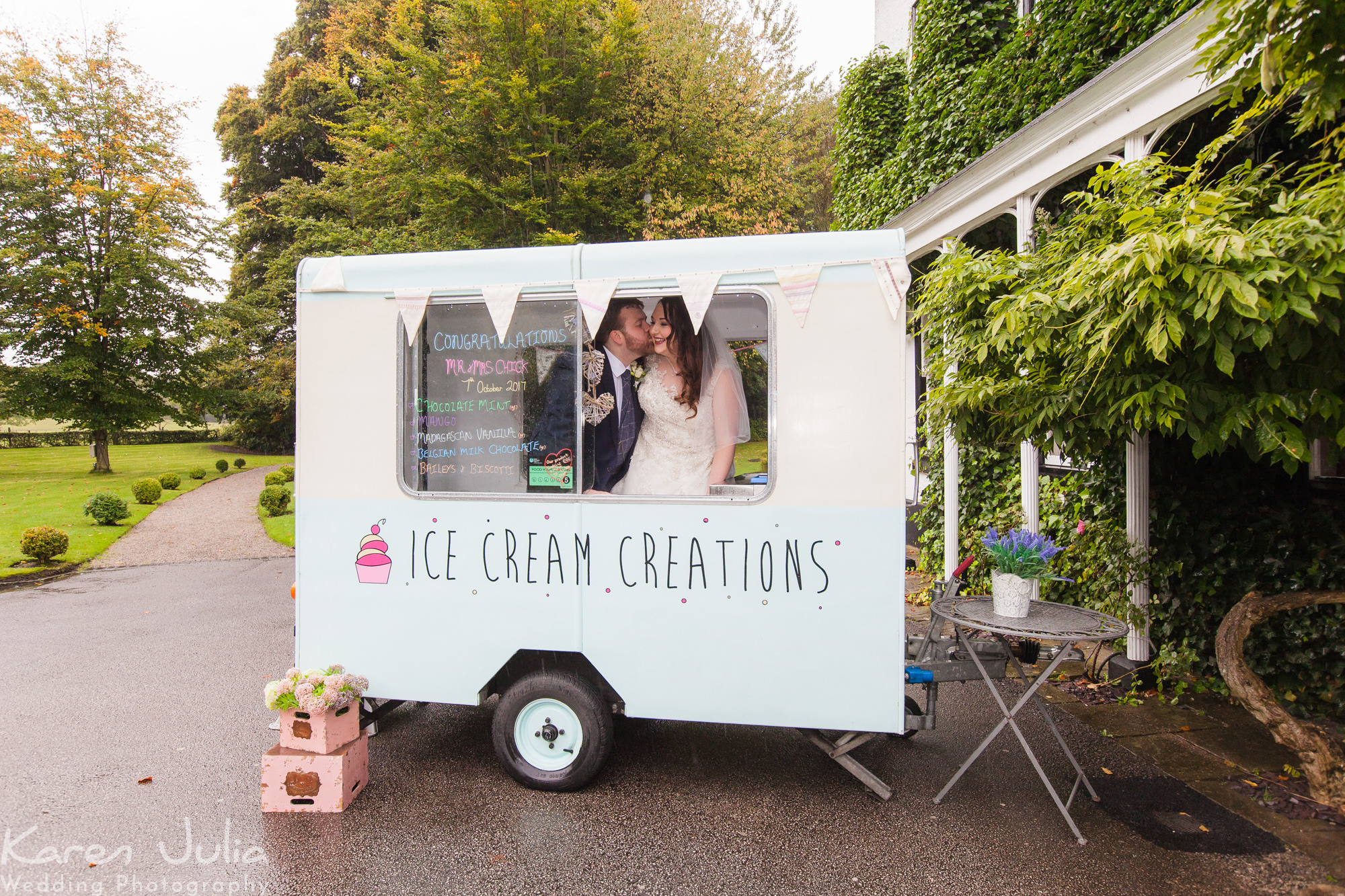 bride and groom in ice cream van at Statham Lodge on their wedding day