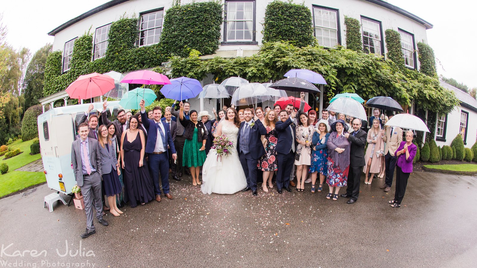 group photo in the rain outside Statham Lodge Hotel