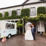 bride and groom portrait next to ice cream van at their Rustic Statham Lodge Autumn Wedding
