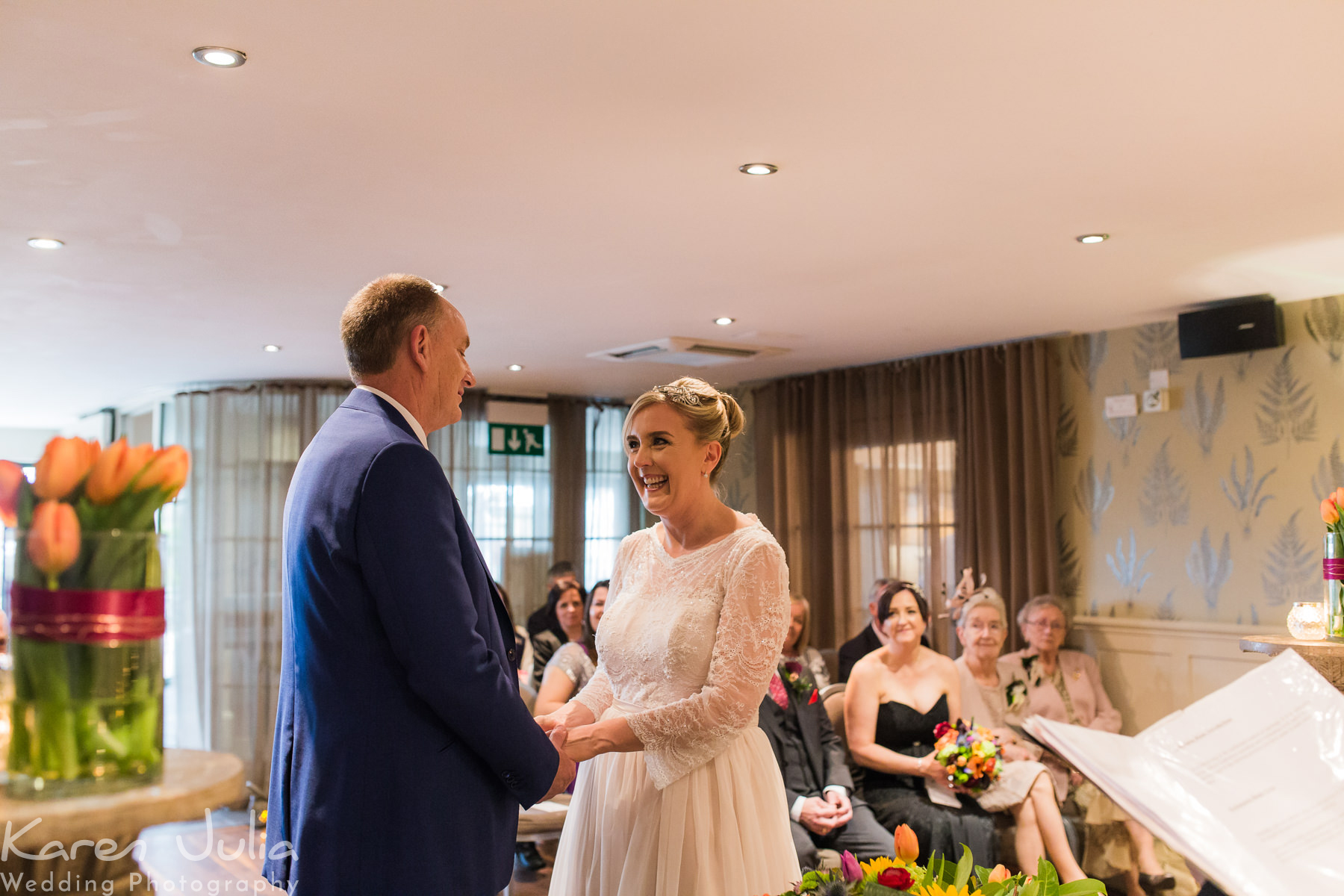 bride and groom exchange vows during wedding ceremony at Great John Street Hotel