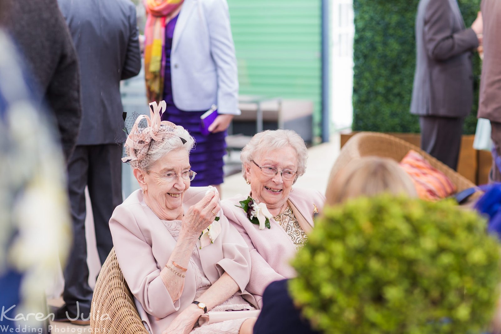 guests chat on the roof terrace with the umbrellas protecting them from the rain