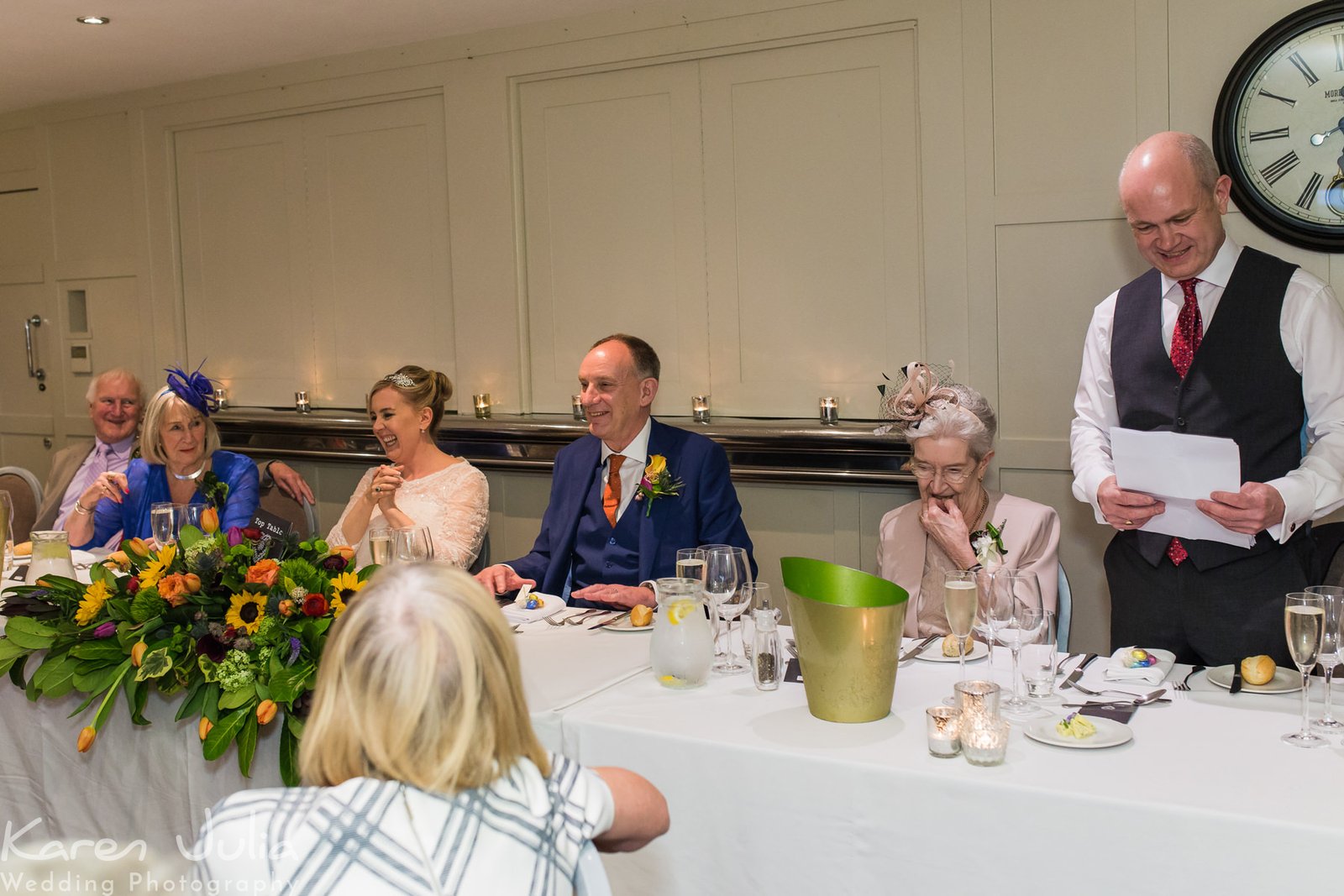 brides brother makes a speech during the wedding breakfast