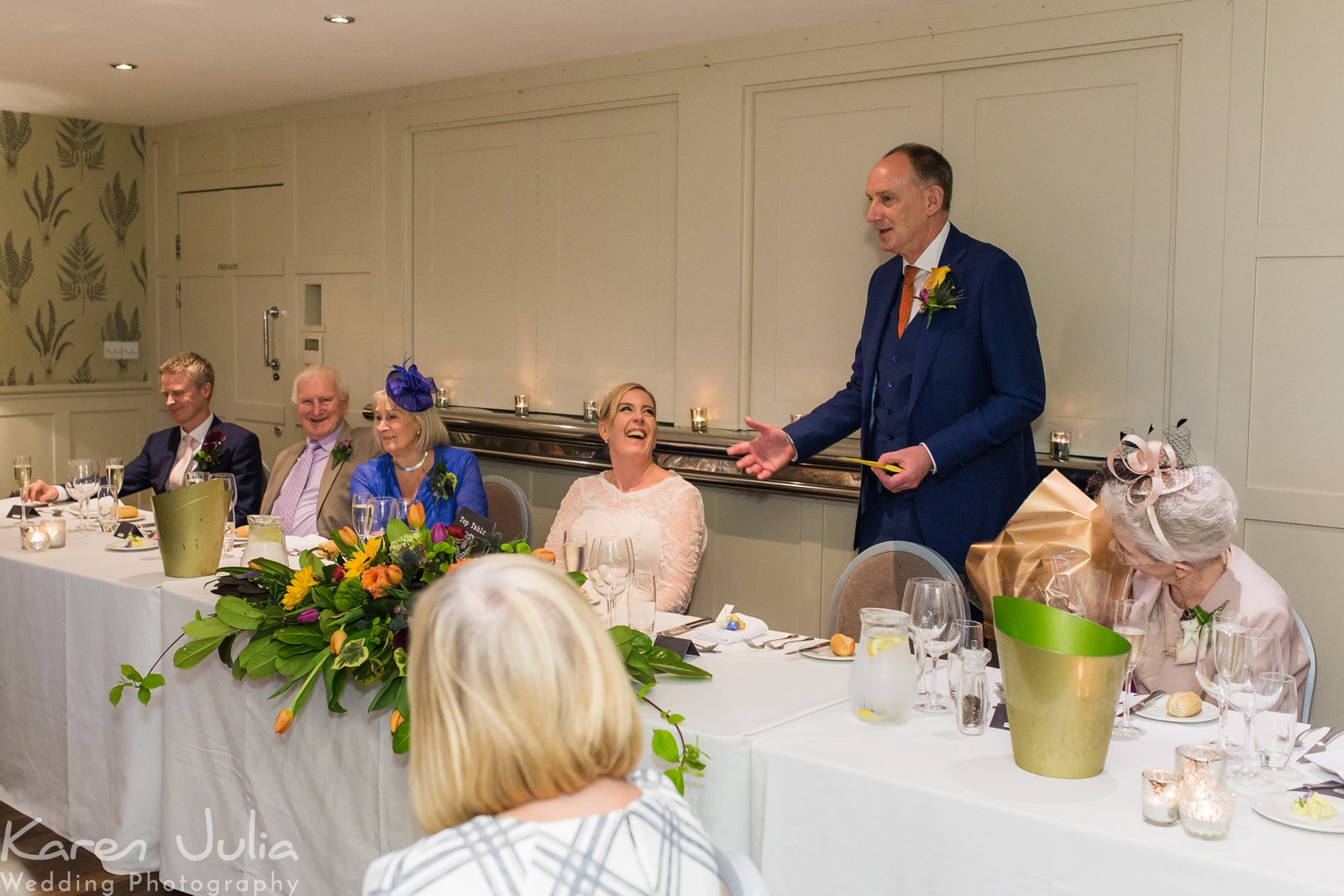 groom makes a speech during the wedding breakfast