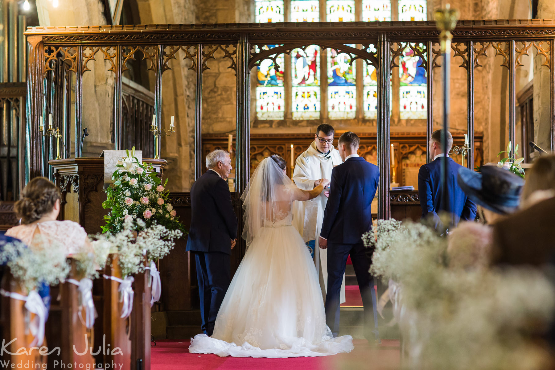 bride and groom during wedding ceremony at St Mary the Virgin church in Long Preston
