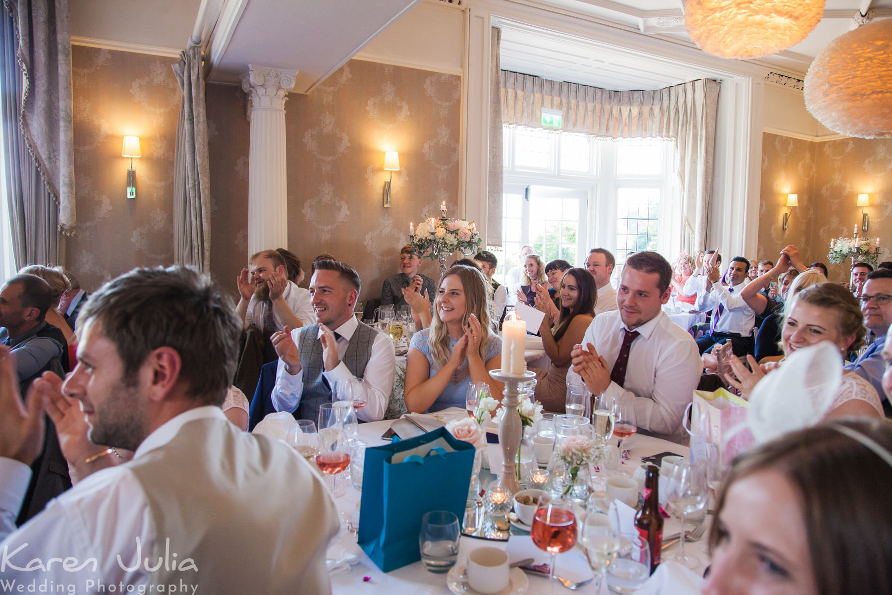 guests clapping during speeches at Falcon Manor