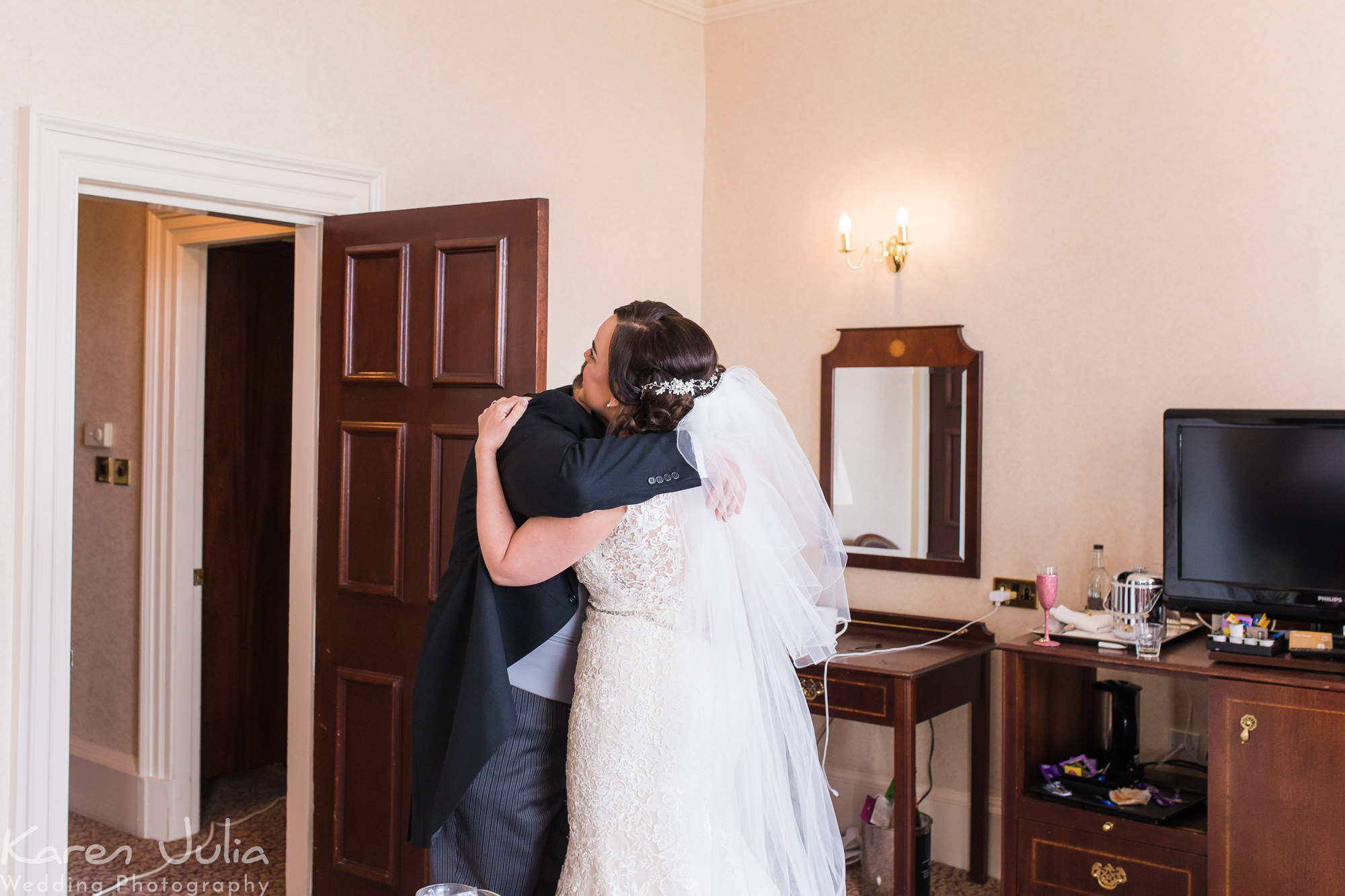 bride and her dad hug before wedding at Shrigley Hall