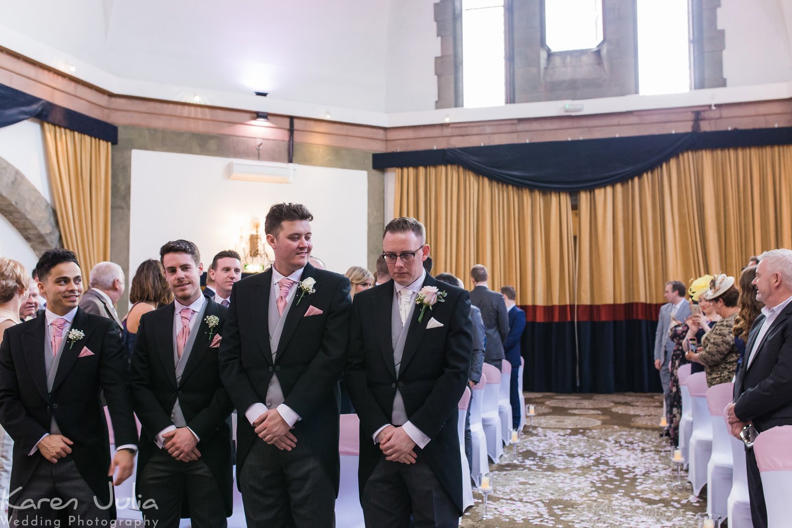 groom waits for his bride in the Tilden suite in Shrigley Hall