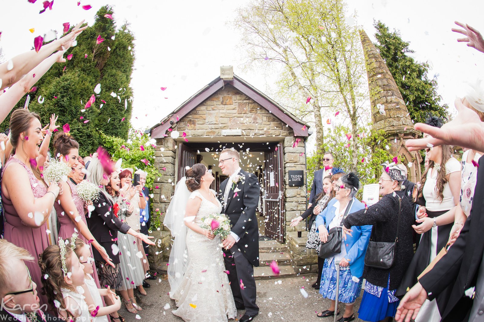 guests throw confetti at wedding at Shrigley Hall